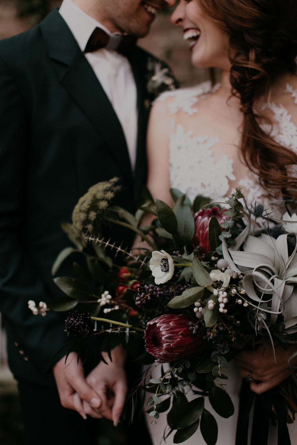 Wintry Bridal Bouquet with air plants, peonies, berries, eucalyptus, and loose, untamed greenery // Nashville Florist