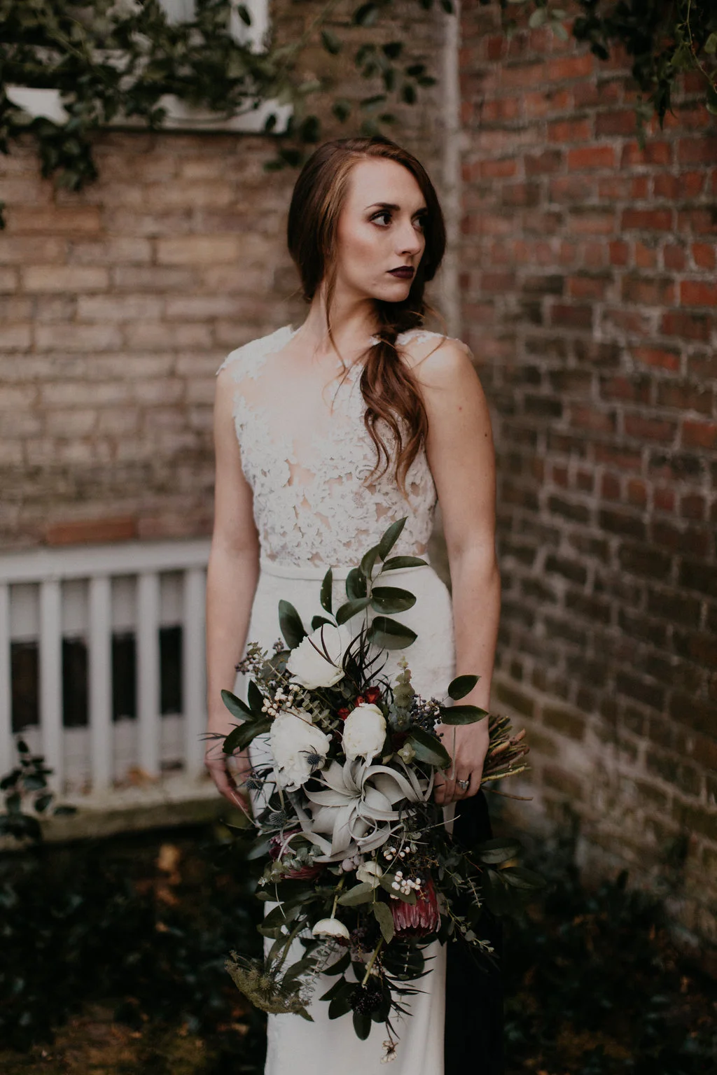 Wintry Bridal Bouquet with air plants, peonies, berries, eucalyptus, and loose, untamed greenery // Nashville Florist