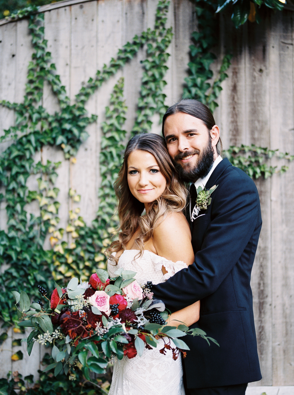 Stylish bride and groom with marsala, wine, and berry toned wedding flowers // Franklin, TN Wedding Florist
