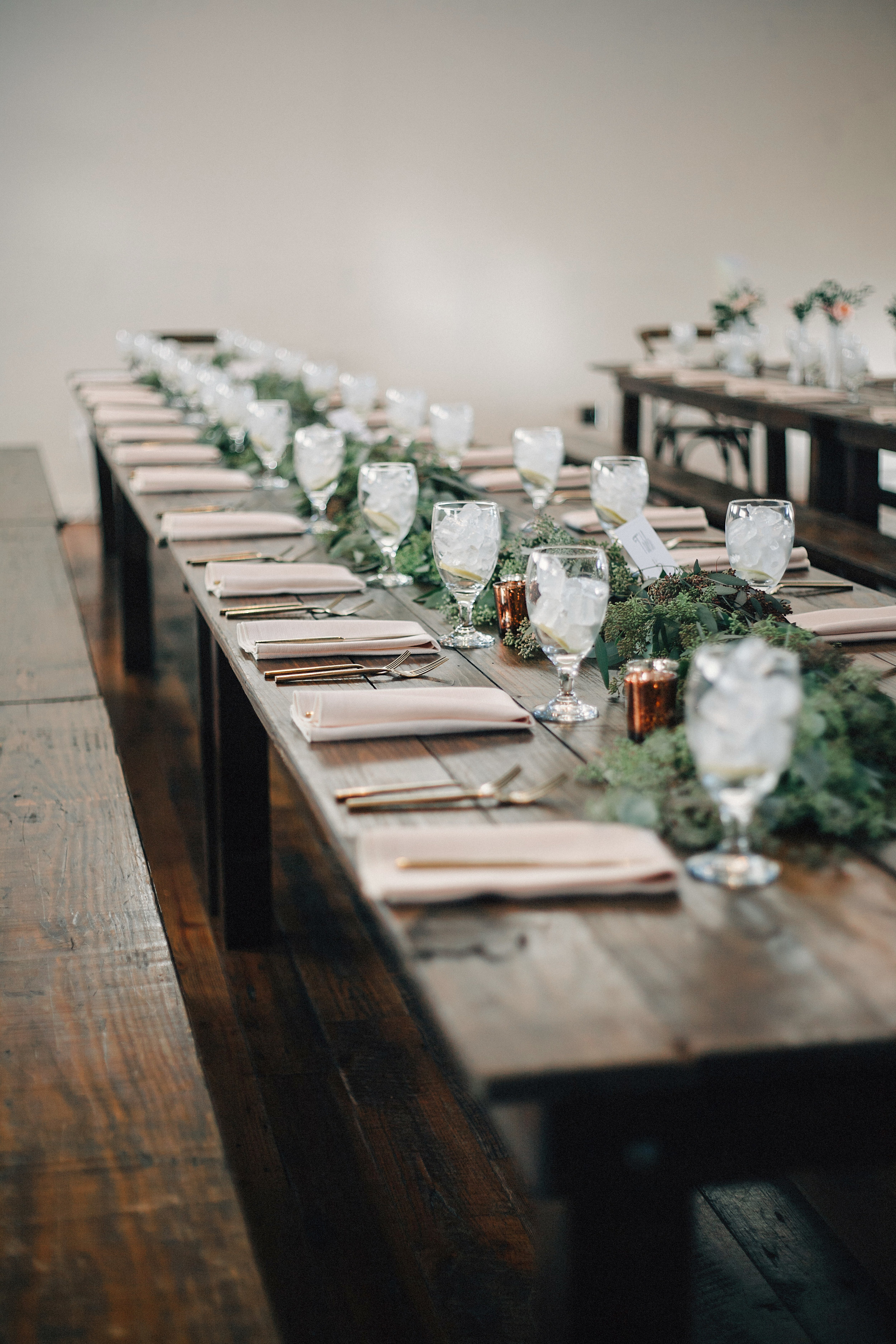 Eucalyptus garland on farm tables at the Cordelle // Nashville Wedding Florist