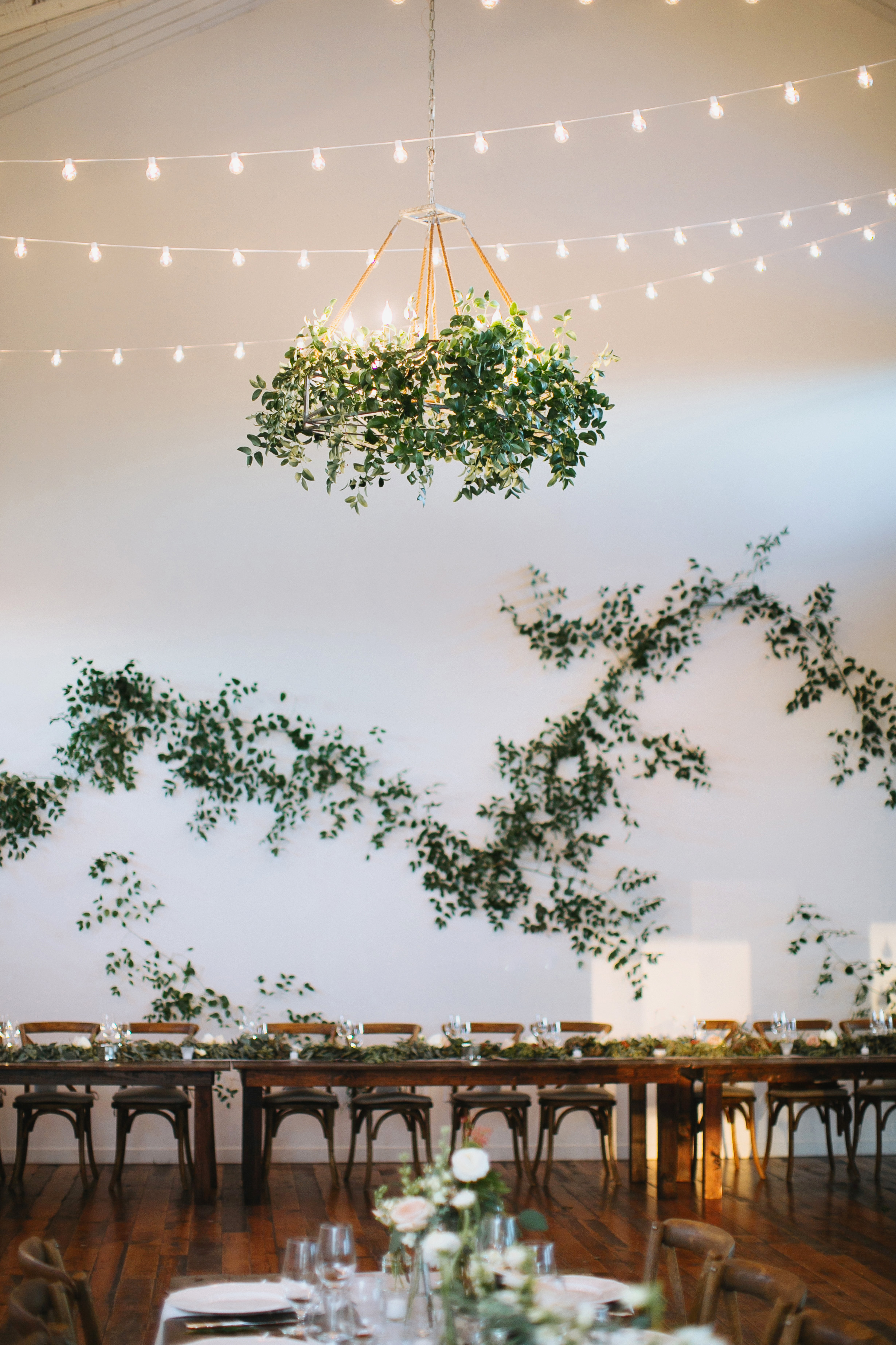 Loose vine like / greenery installation on large white wall // Nashville Wedding Florist