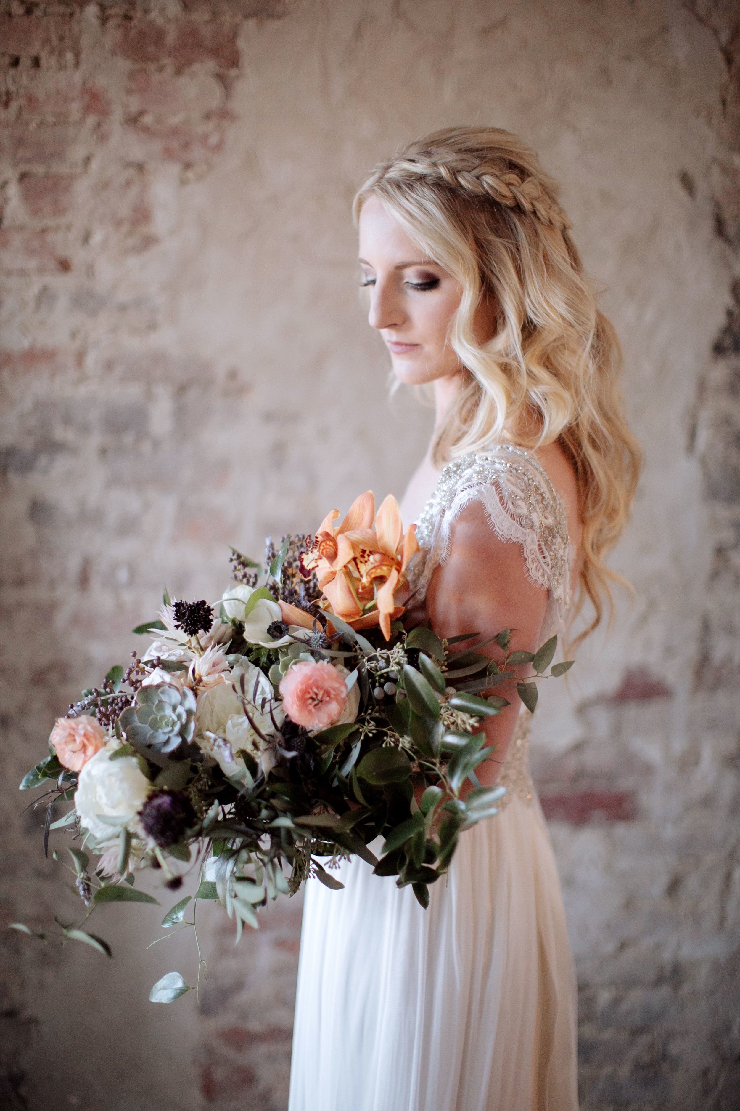 Whimsical, organic bridal bouquet with neutral, blush, and copper tones, using orchids, ranunculus, and garden roses // Nashville Wedding Florist