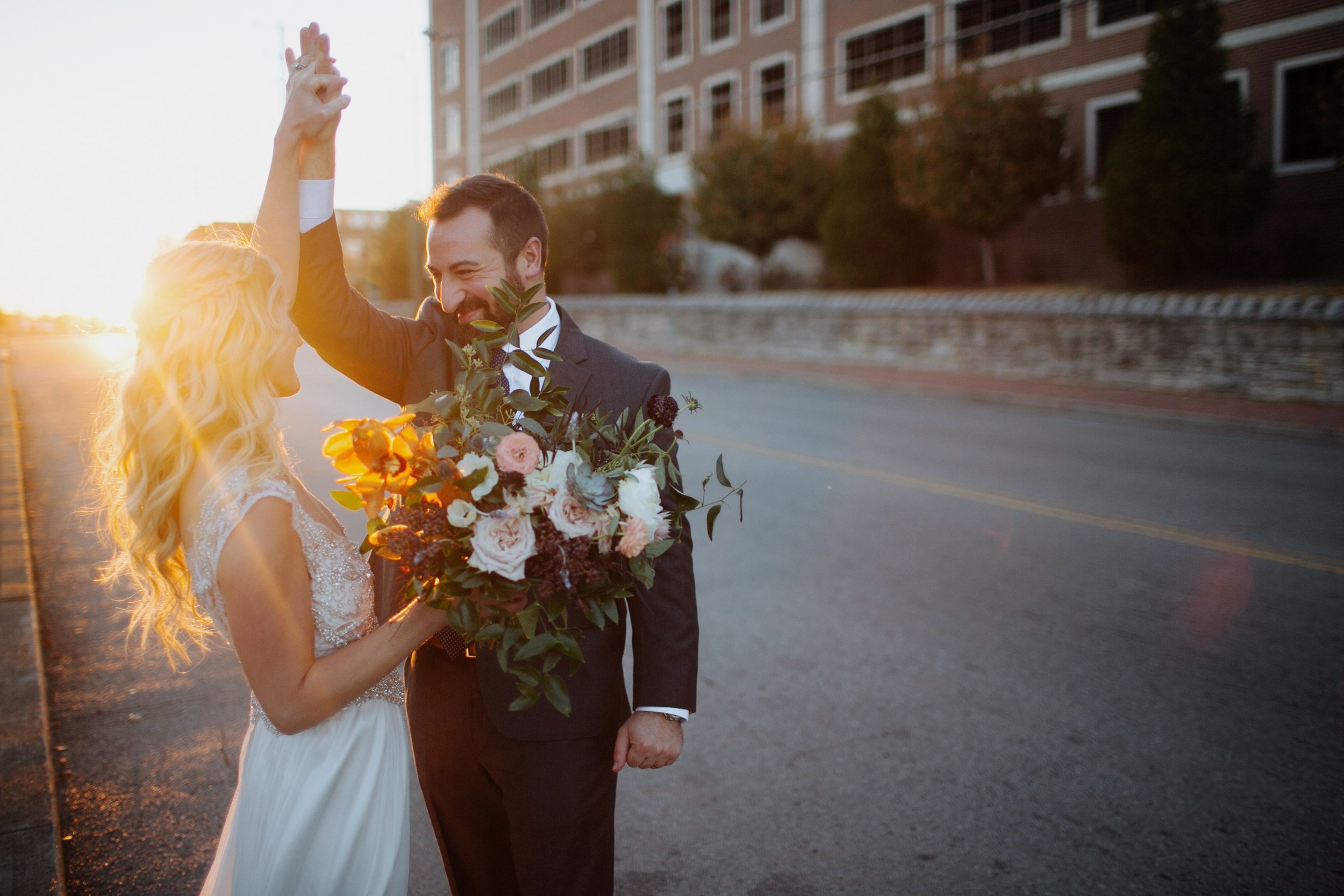 Newlyweds dancing in the street! Organic floral design in Nashville, TN.