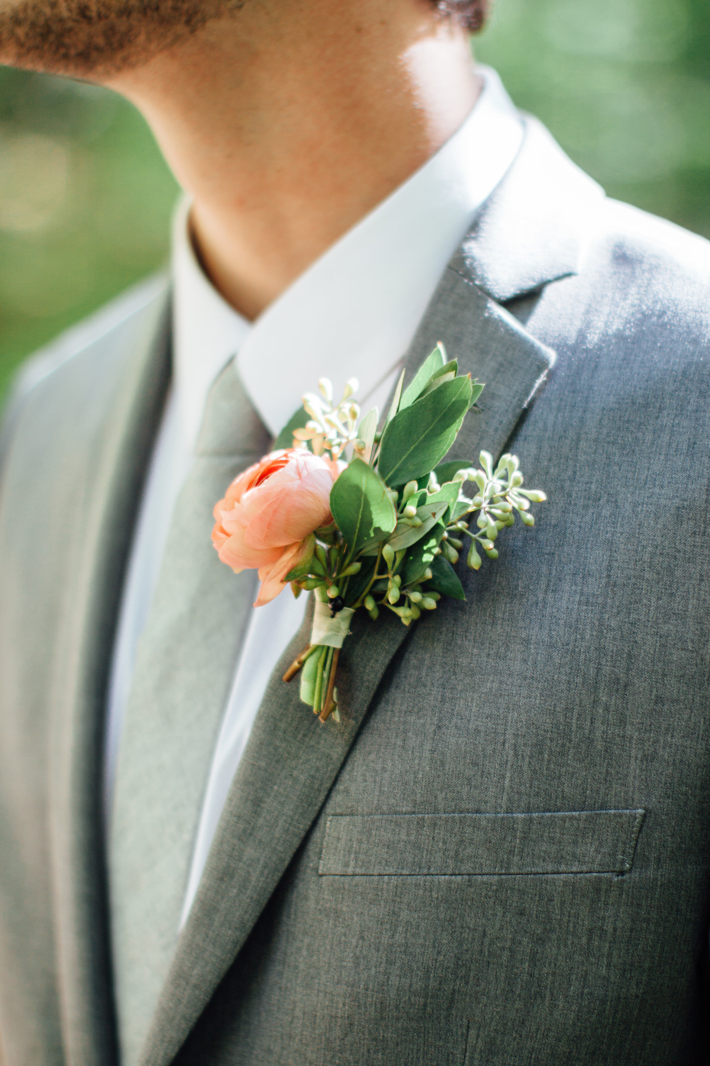 Peach ranunculus boutonniere // Southern Wedding Florist