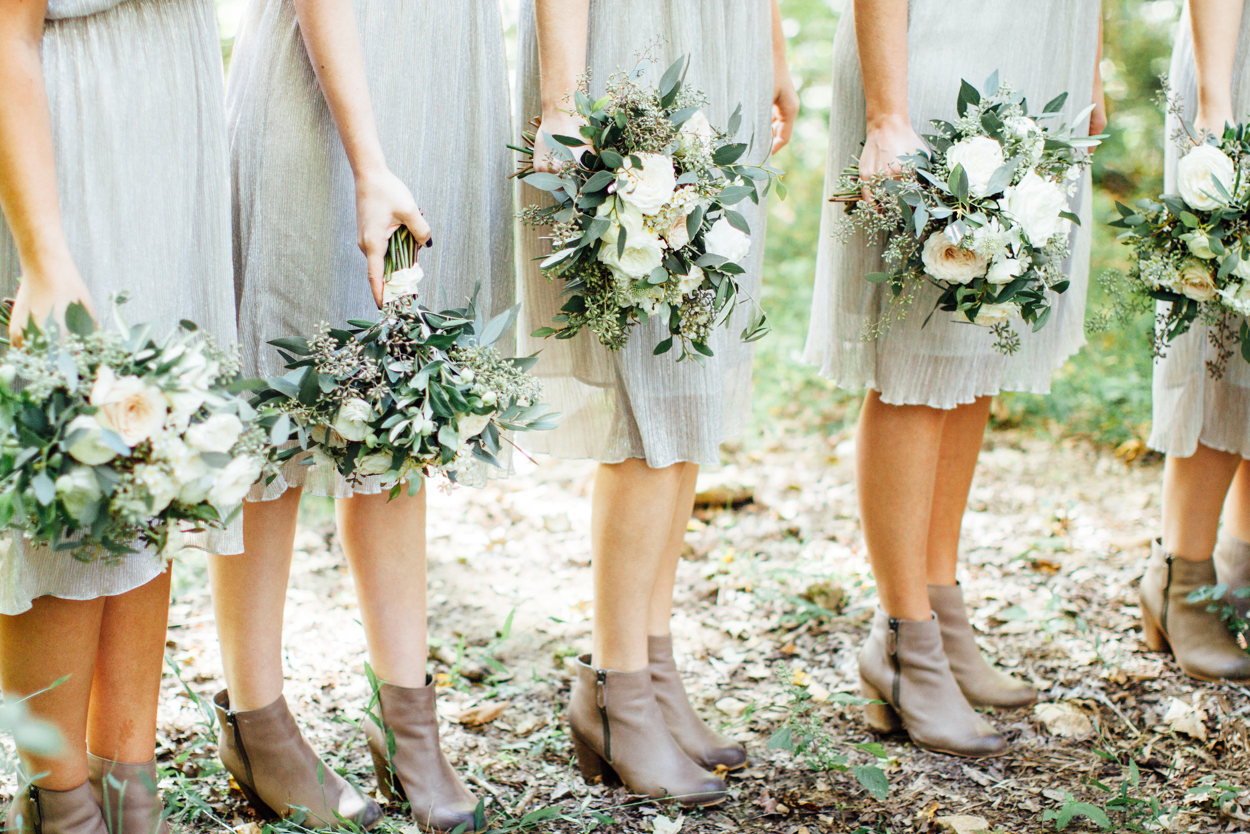 Lush bridesmaid bouquets with lots of greenery and cute boots // Nashville Wedding Floral Design