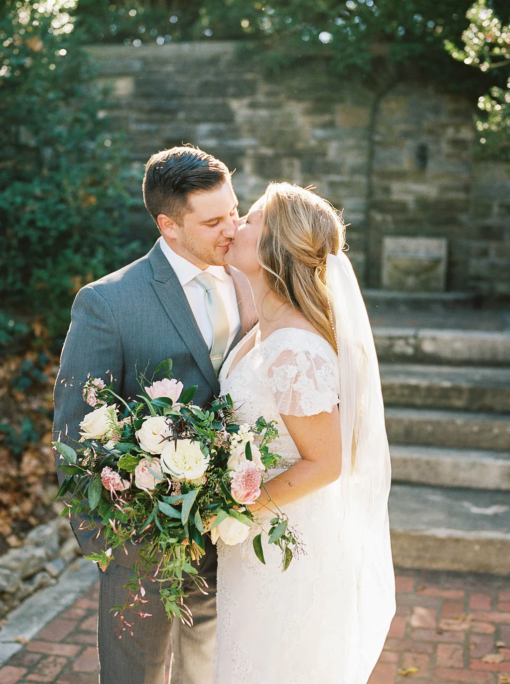 Lush, natural bridal bouquet with garden roses, tulips, ranunculus, and greenery // Nashville Wedding Florist