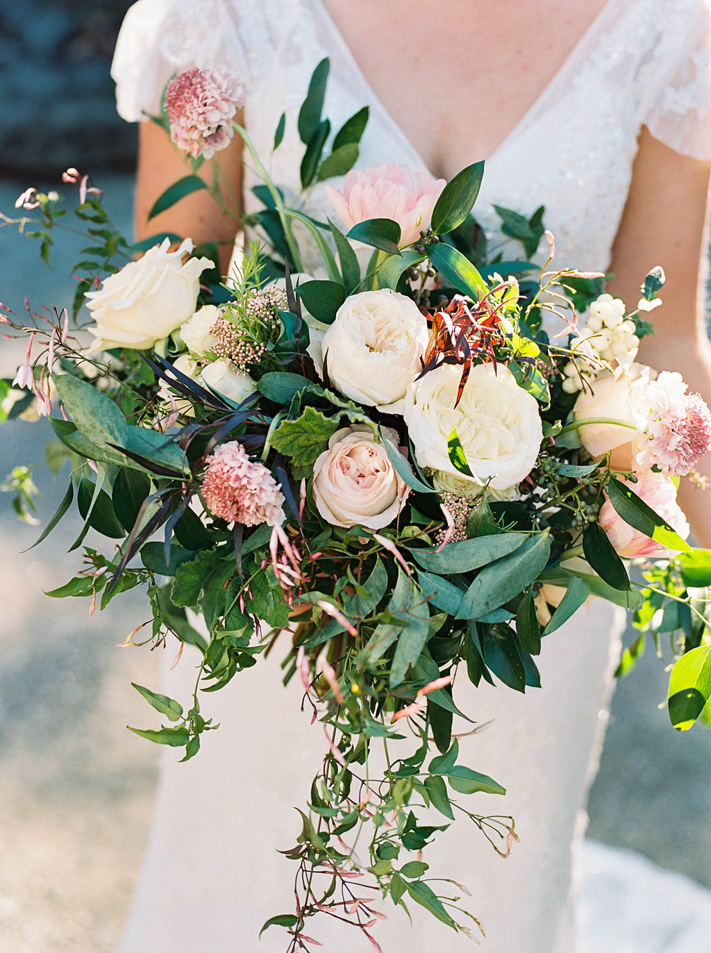 Lush, natural bridal bouquet with blush garden roses, tulips, ranunculus, and greenery // Nashville Wedding Florist