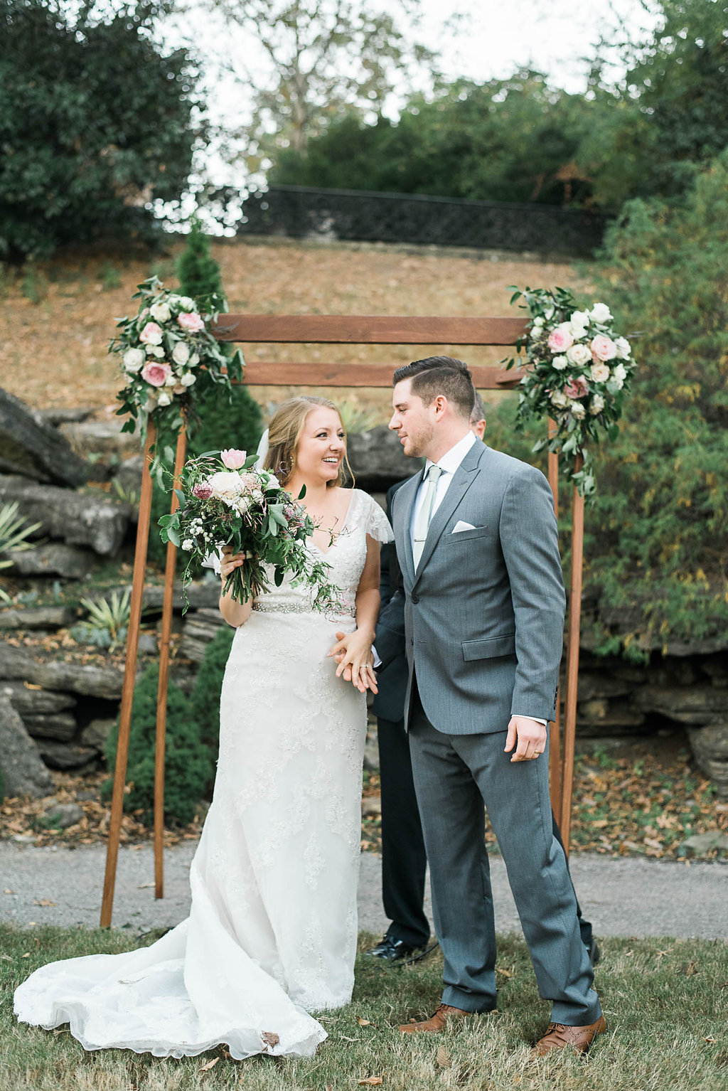 Simple wooden chuppah with lush, natural flowers // Nashville Wedding Florist