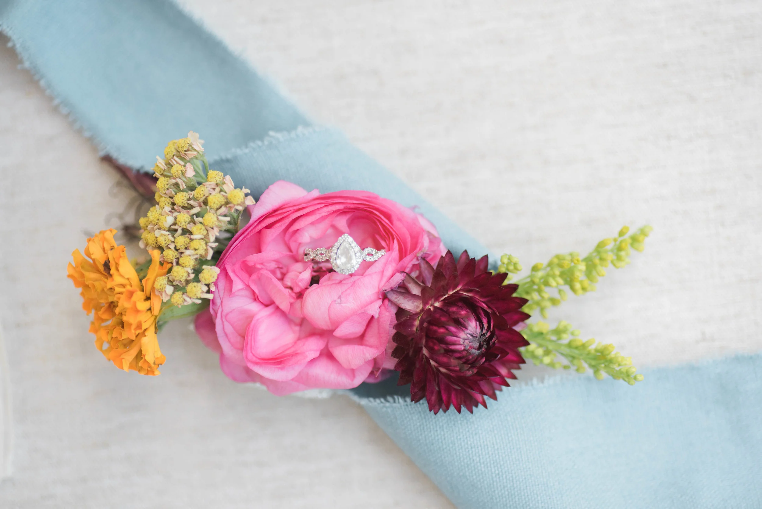 Teardrop diamond ring with bright florals