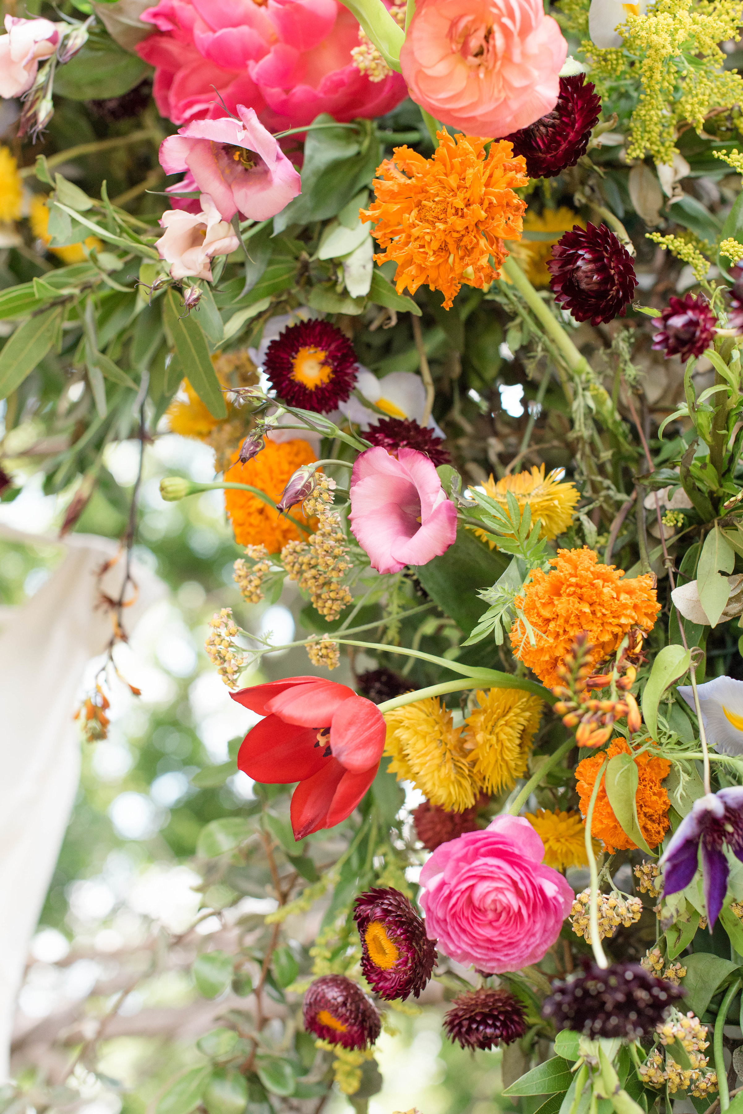 Lush, brightly colored arbor for wedding backdrop // Nashville Wedding Florist