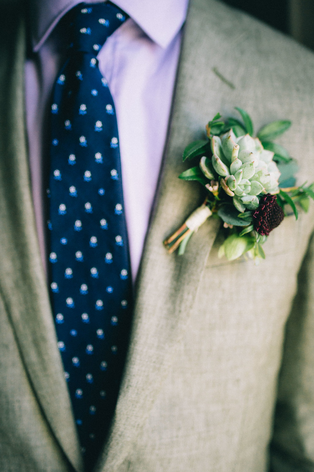 Succulent boutonniere with touches of burgundy // Nashville Wedding Flowers