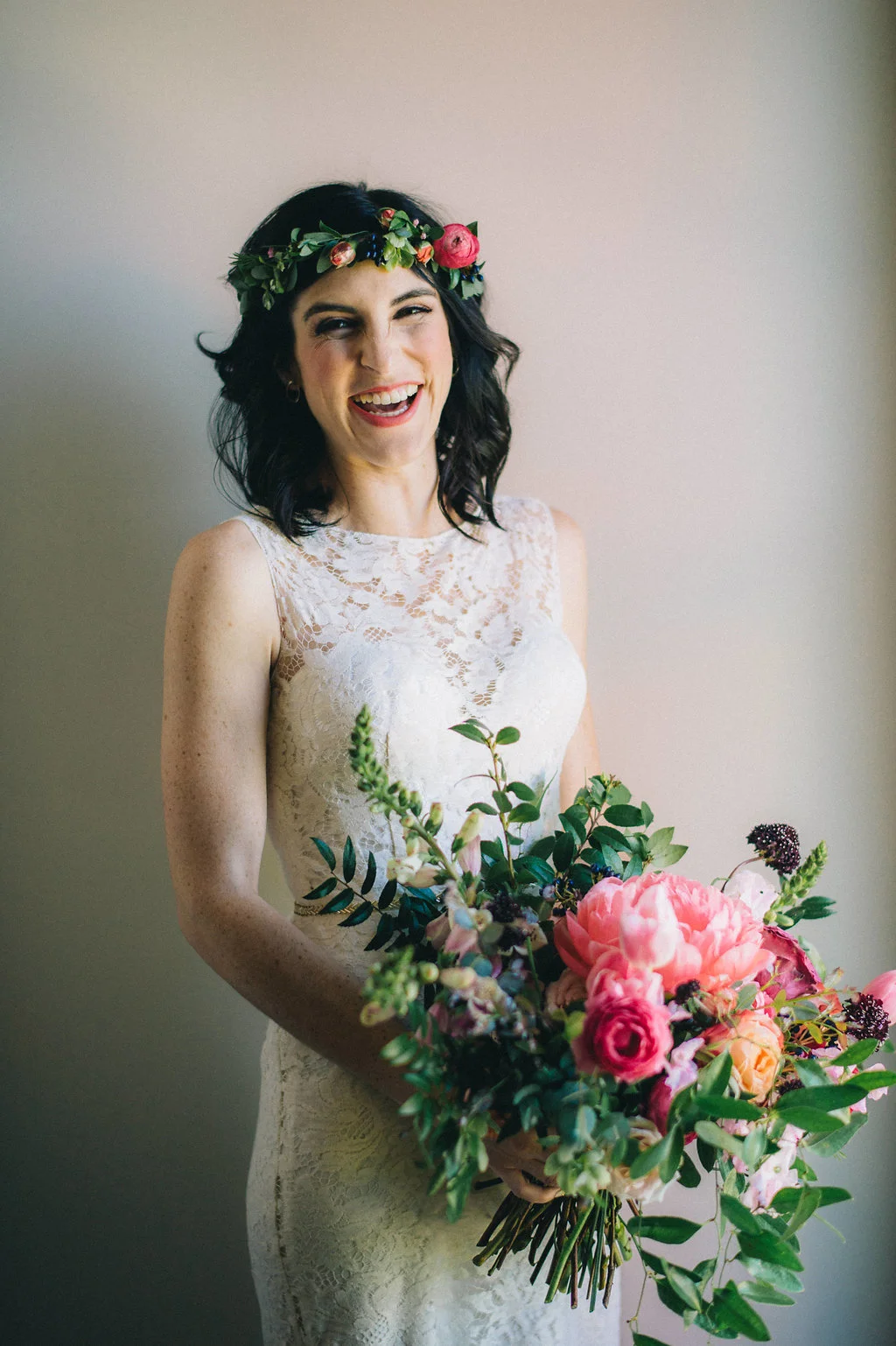 Lush bridal bouquet with coral charm peonies, tulips, ranunculus, and sweet peas // Nashville Wedding Floral Designer