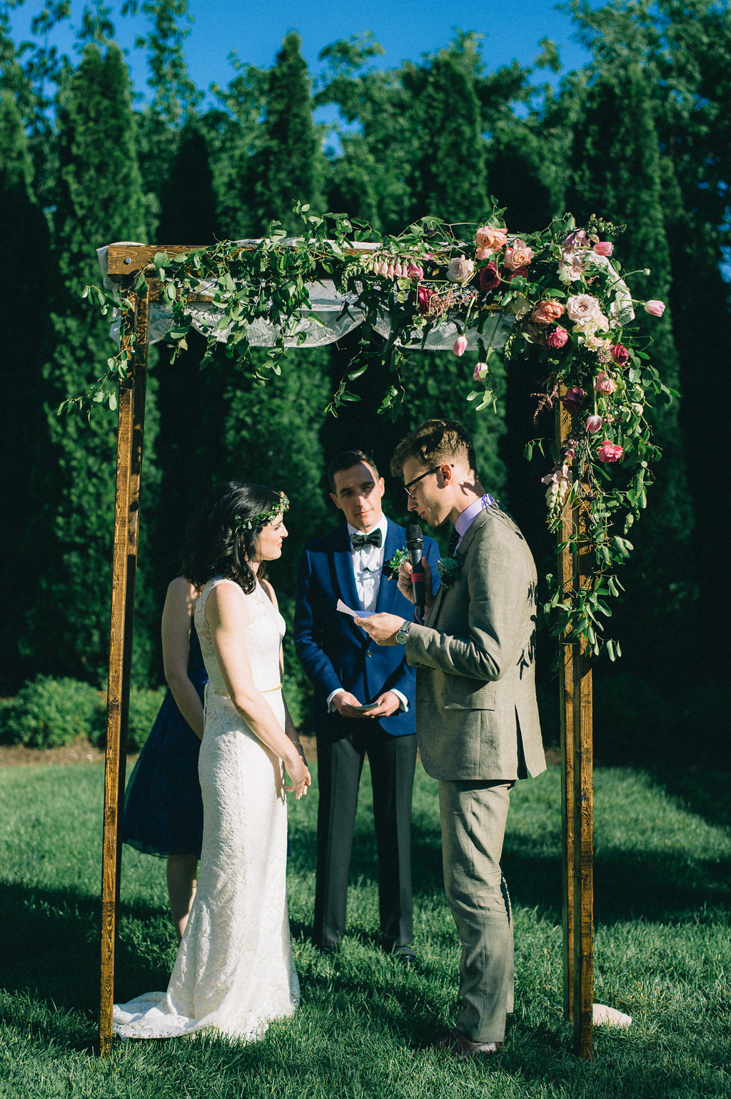 Simple wooden chuppah with heirloom lace and lush, brightly colored florals // Nashville Wedding Floral Designer