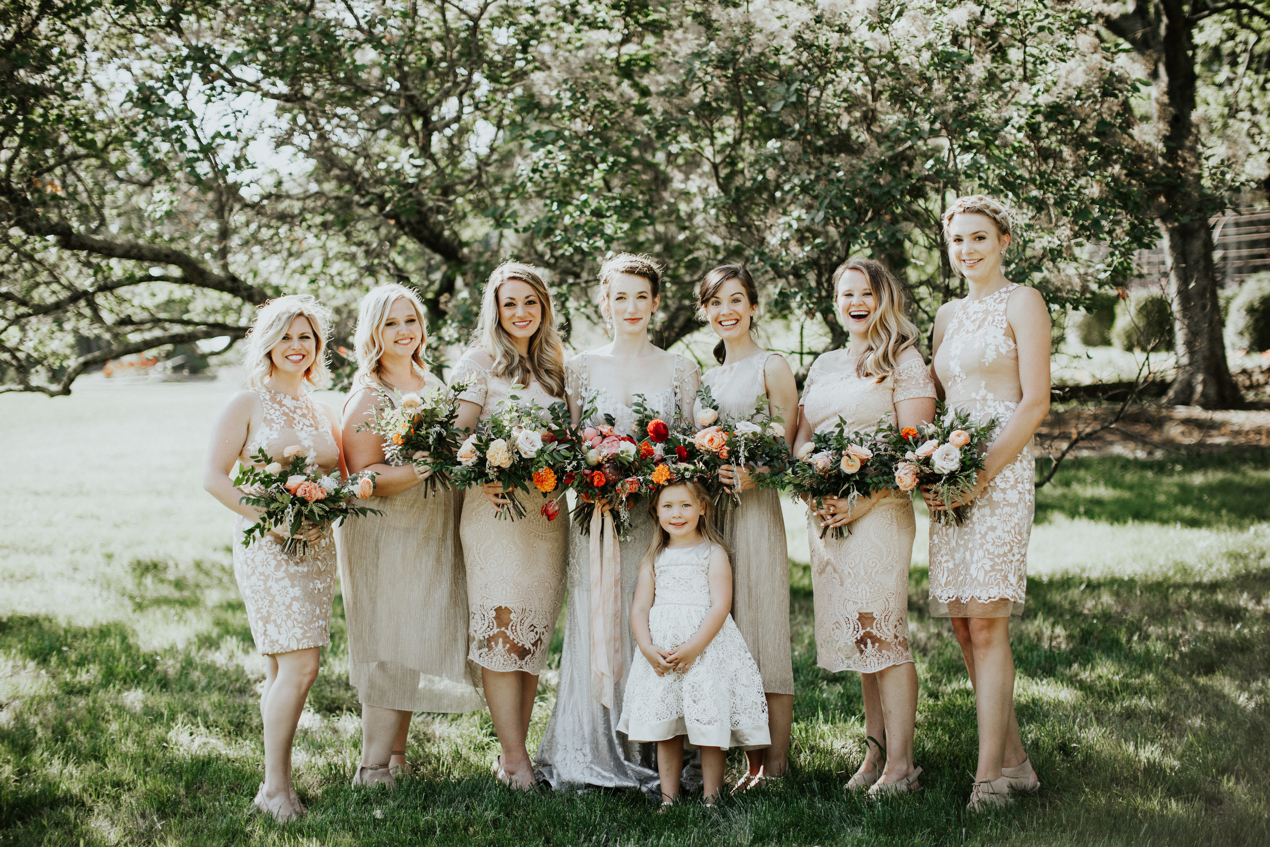 Neutral bridesmaid dresses with silvery blue wedding dress // Organic, natural floral design in Nashville