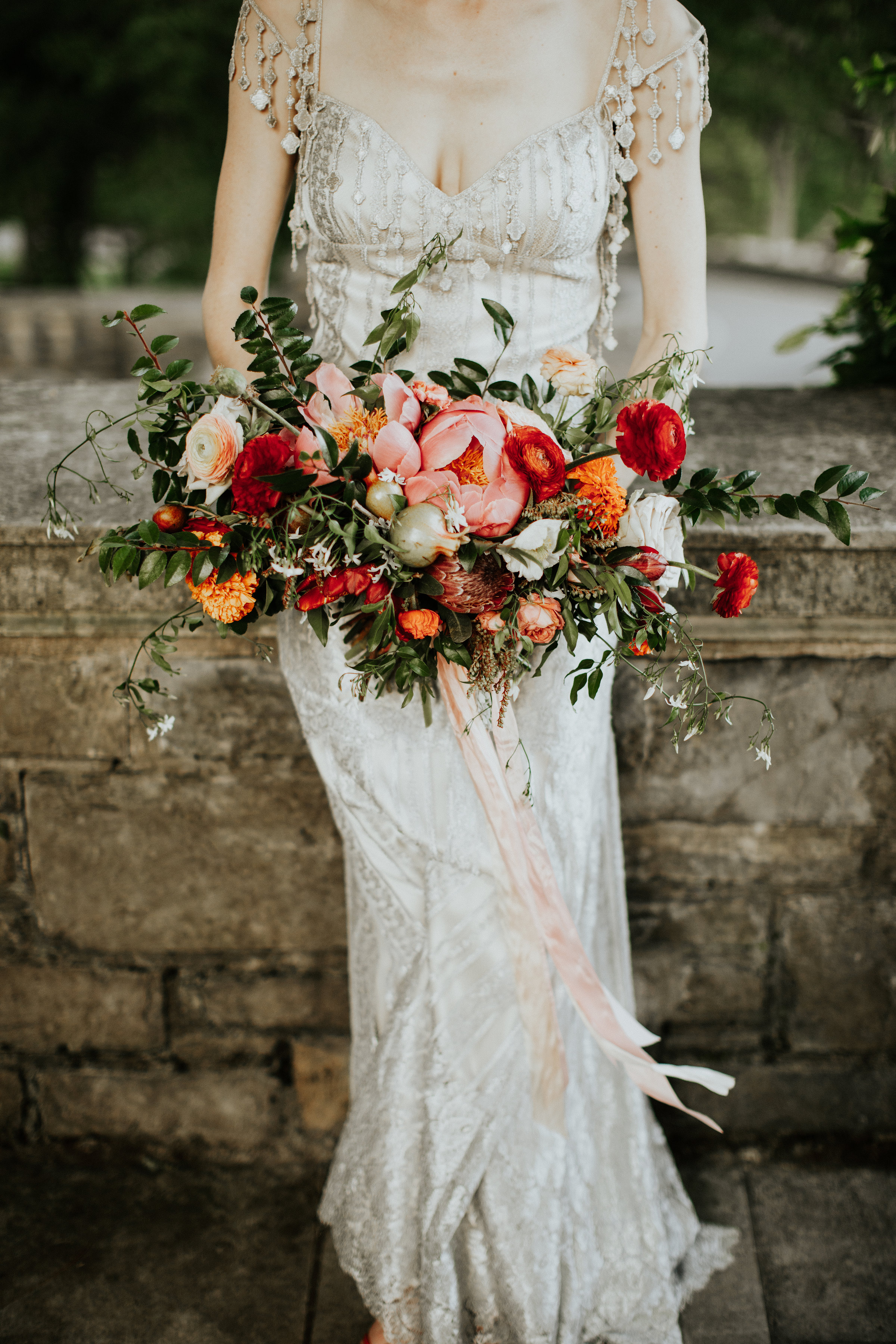 Bridal bouquet with ranunculus, pomegranates, peonies, and natural, untamed greenery // Nashville Wedding Florist