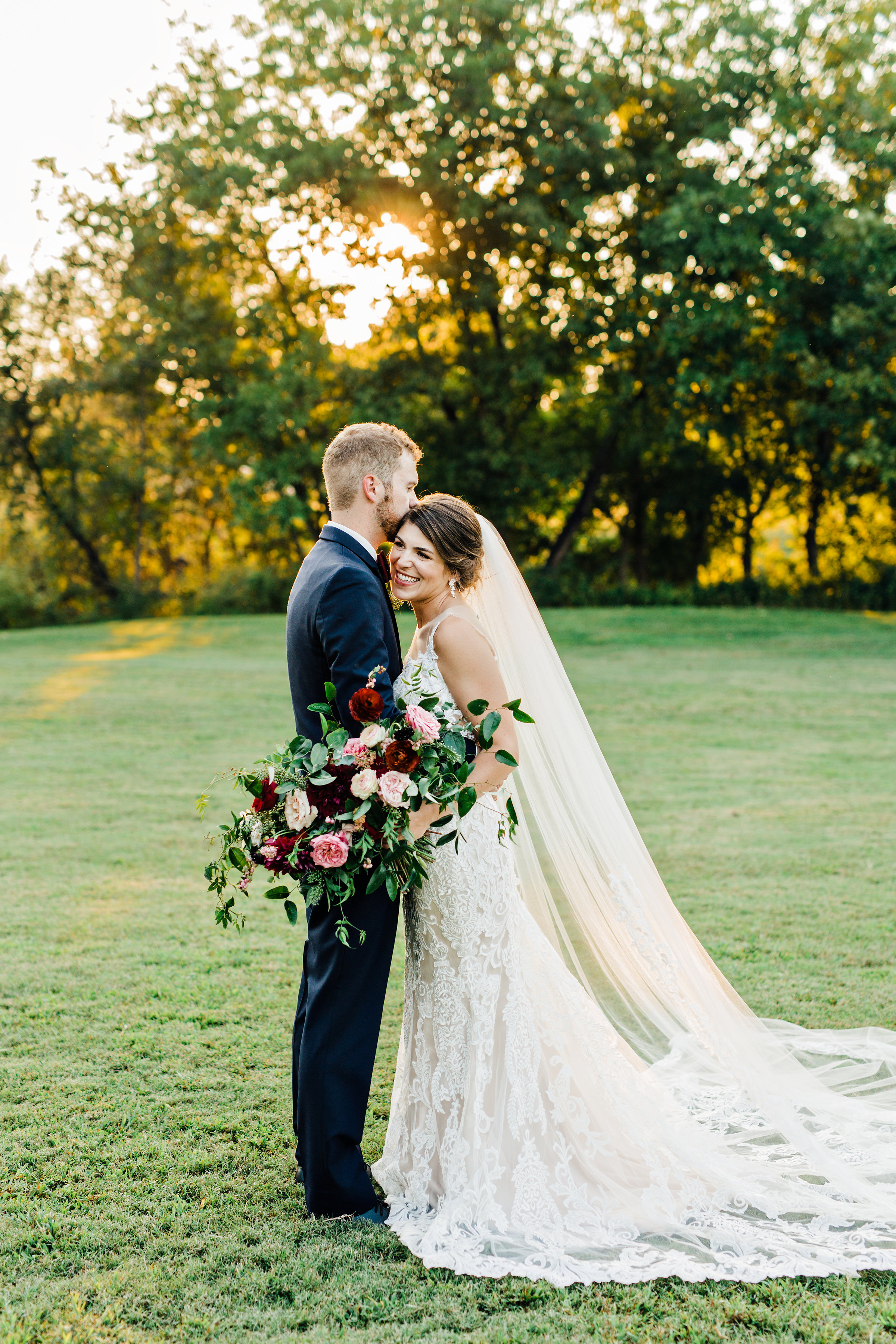 Sunset bride and groom portraits // Lush  marsala wedding florals
