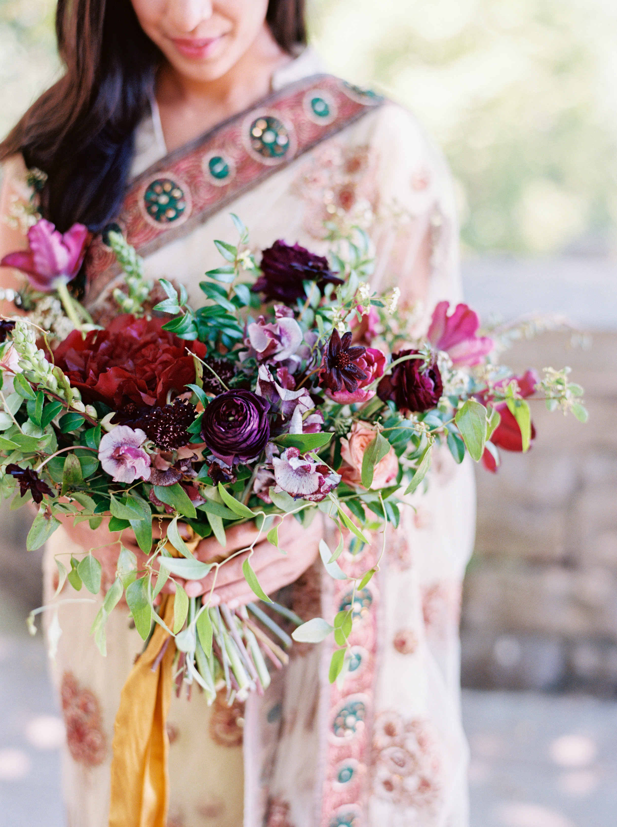 Indian Bridal Portraits at Cheekwood // Lush, untamed bridal bouquet in shades of plum and marsala