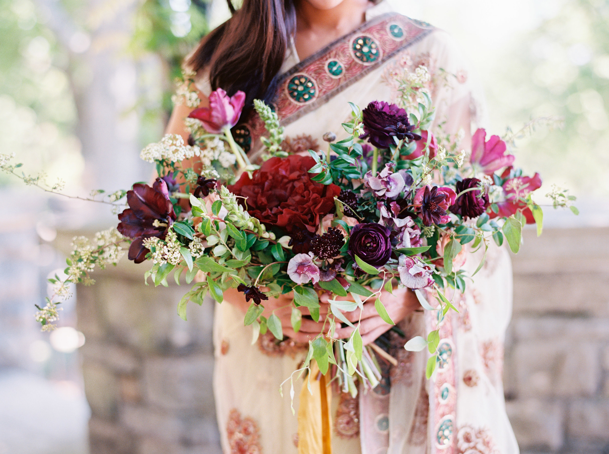 Indian Bridal Portraits at Cheekwood // Lush, untamed bridal bouquet in shades of plum and marsala