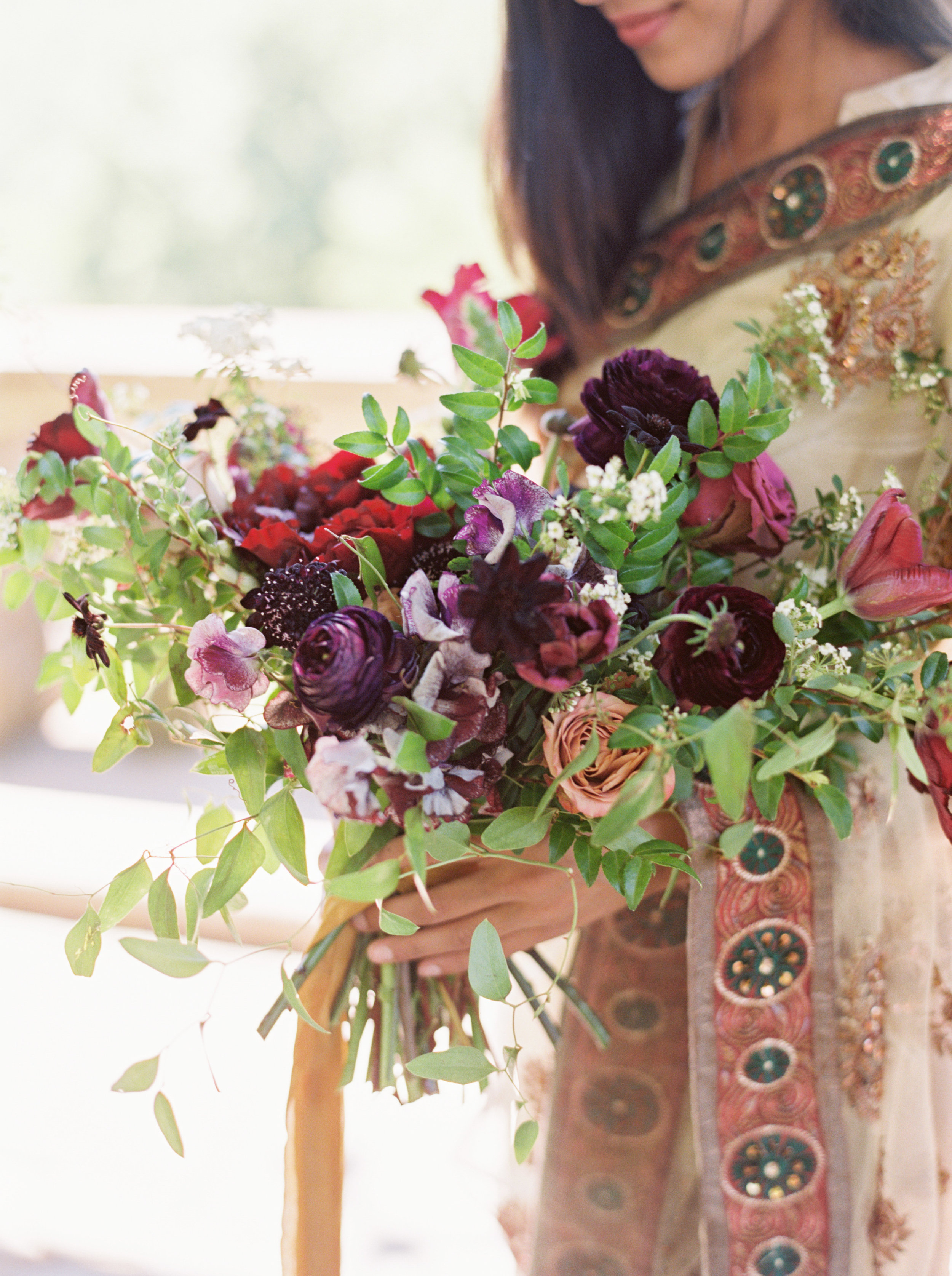 Natural, untamed bridal bouquet with ranunculus, peonies, and sweet peas // Nashville Indian Wedding Florist
