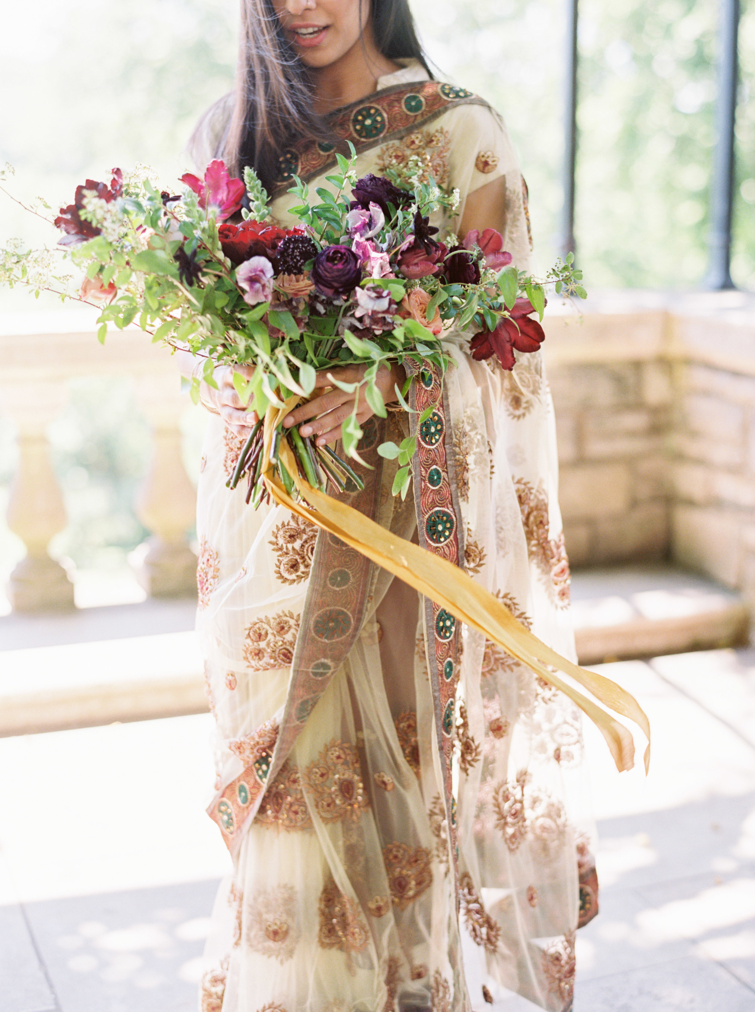 Marsala and plum bouquet of ranunculus, peonies, tulips, and lush greenery // Nashville Wedding Florist
