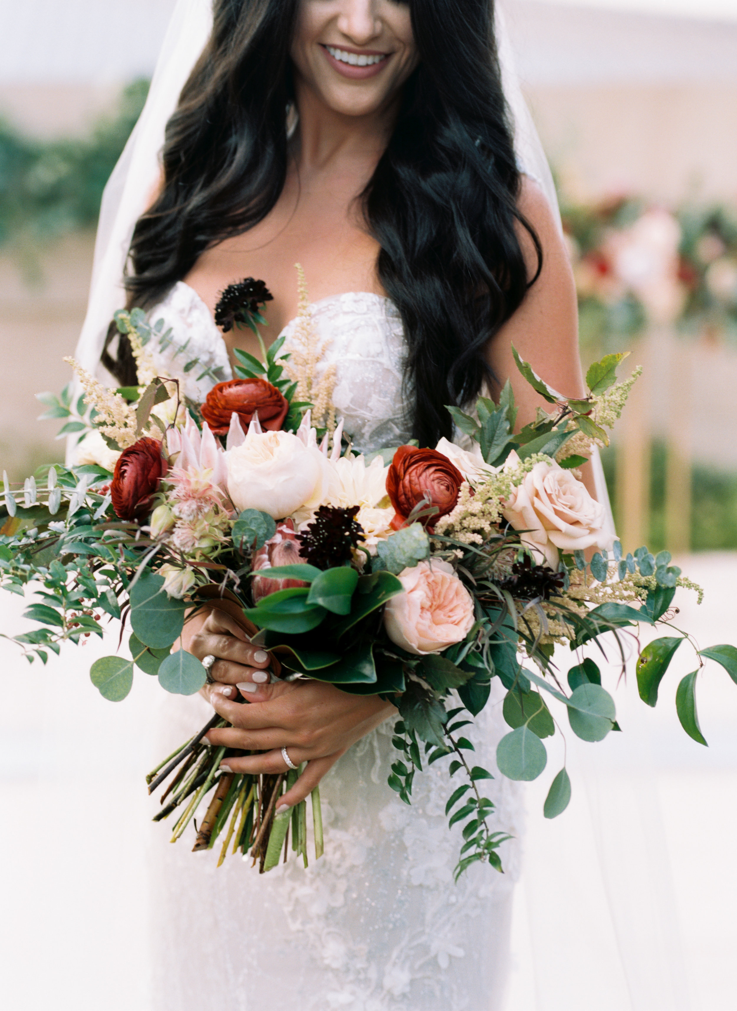 Organic, lush bridal bouquet with protea, ranunculus, and garden roses // Nashville Wedding Floral Design