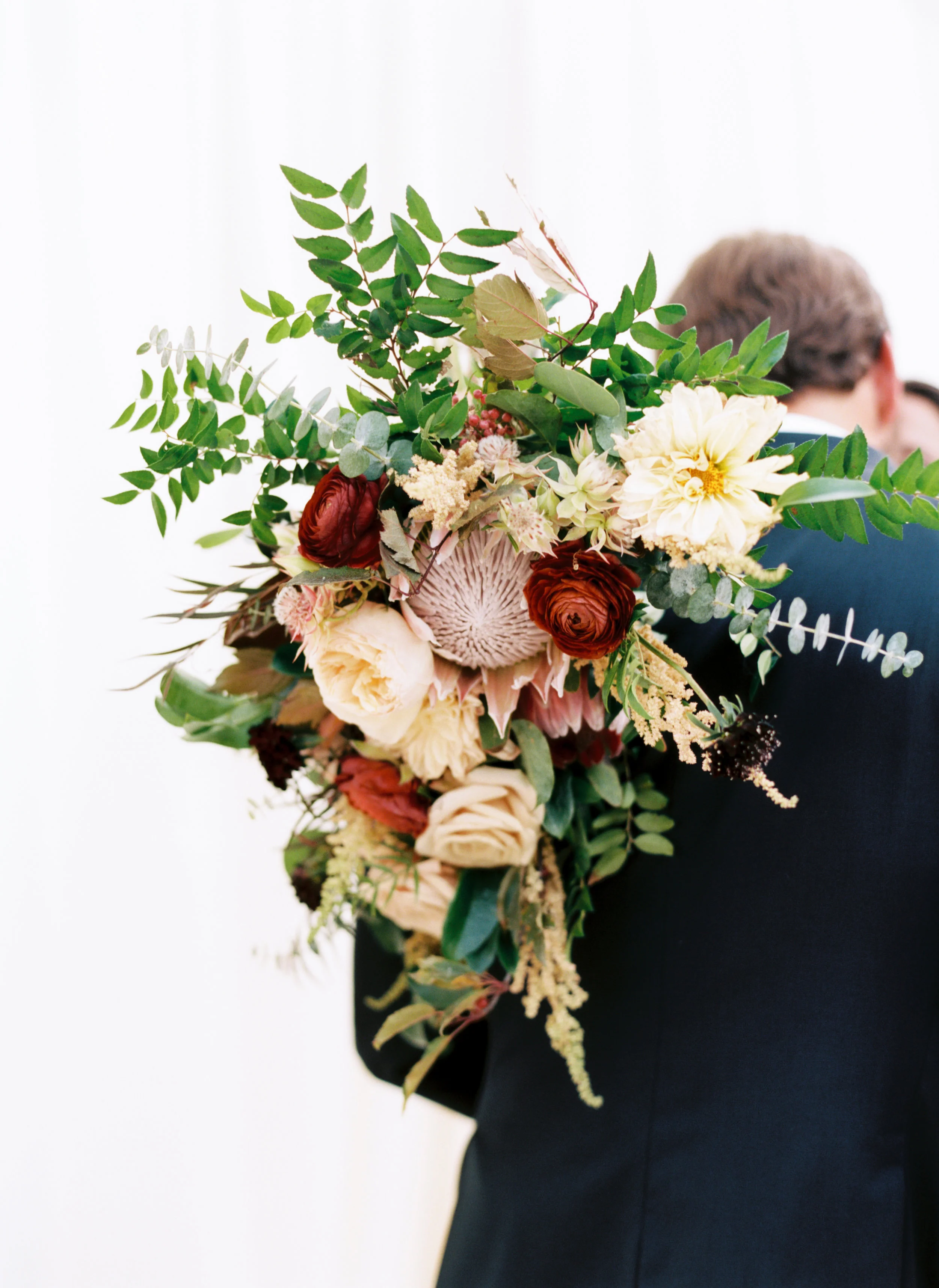 Blush and marsala wedding flowers with protea, ranunculus, and lots of greenery and texture // Country Music Hall of Fame Wedding, Nashville