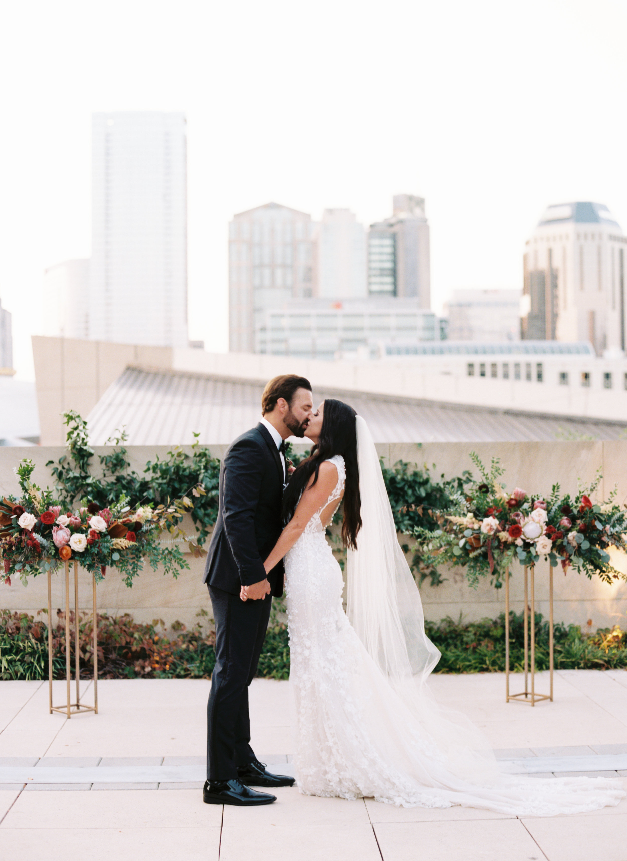 Blush and marsala wedding flowers with protea, ranunculus, and lots of greenery and texture // Country Music Hall of Fame Wedding, Nashville