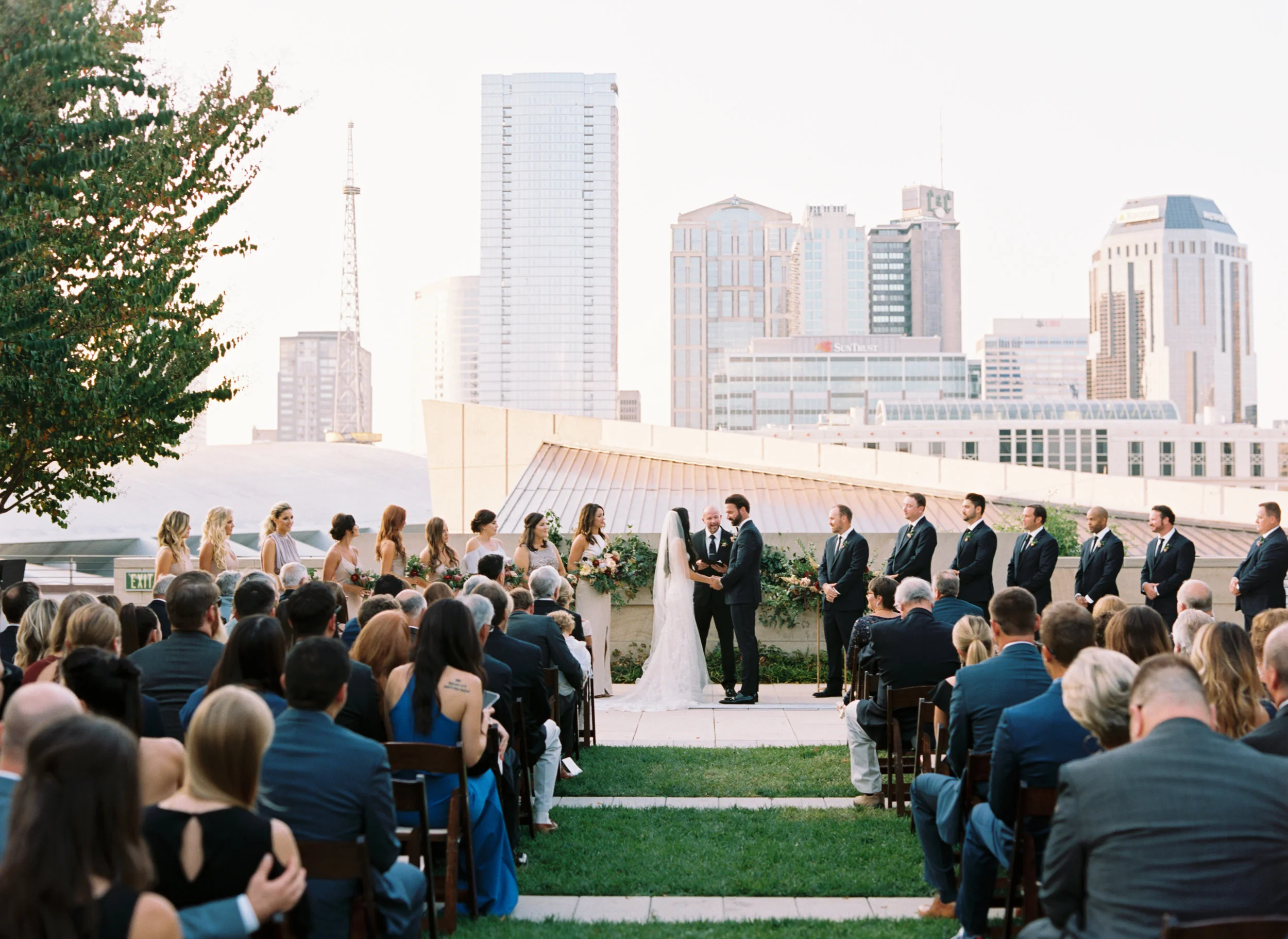 Blush and marsala wedding flowers with protea, ranunculus, and lots of greenery and texture // Country Music Hall of Fame Wedding, Nashville