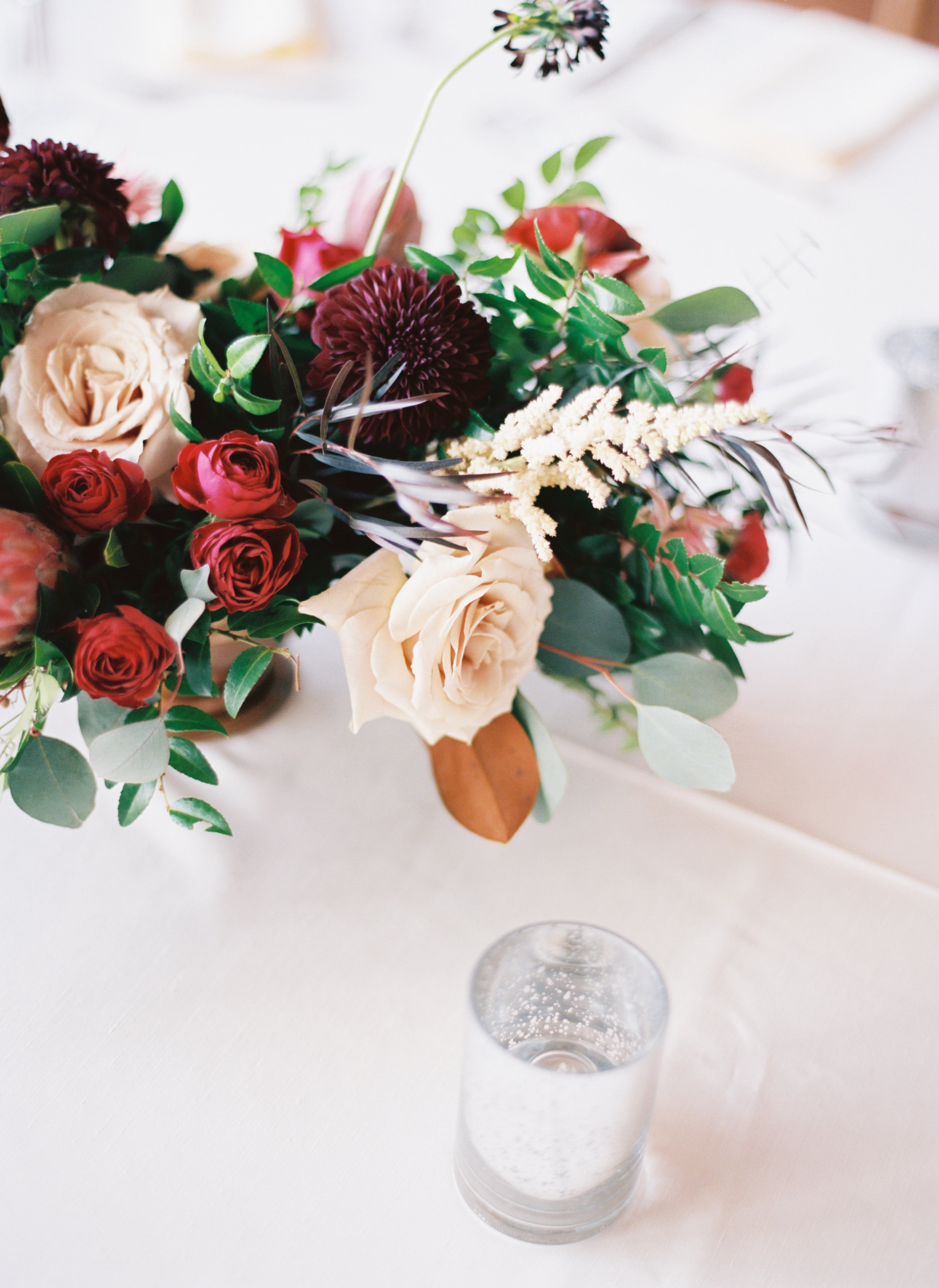 Marsala dahlias, peach astilbe, protea, and natural greenery // Nashville Wedding Florist