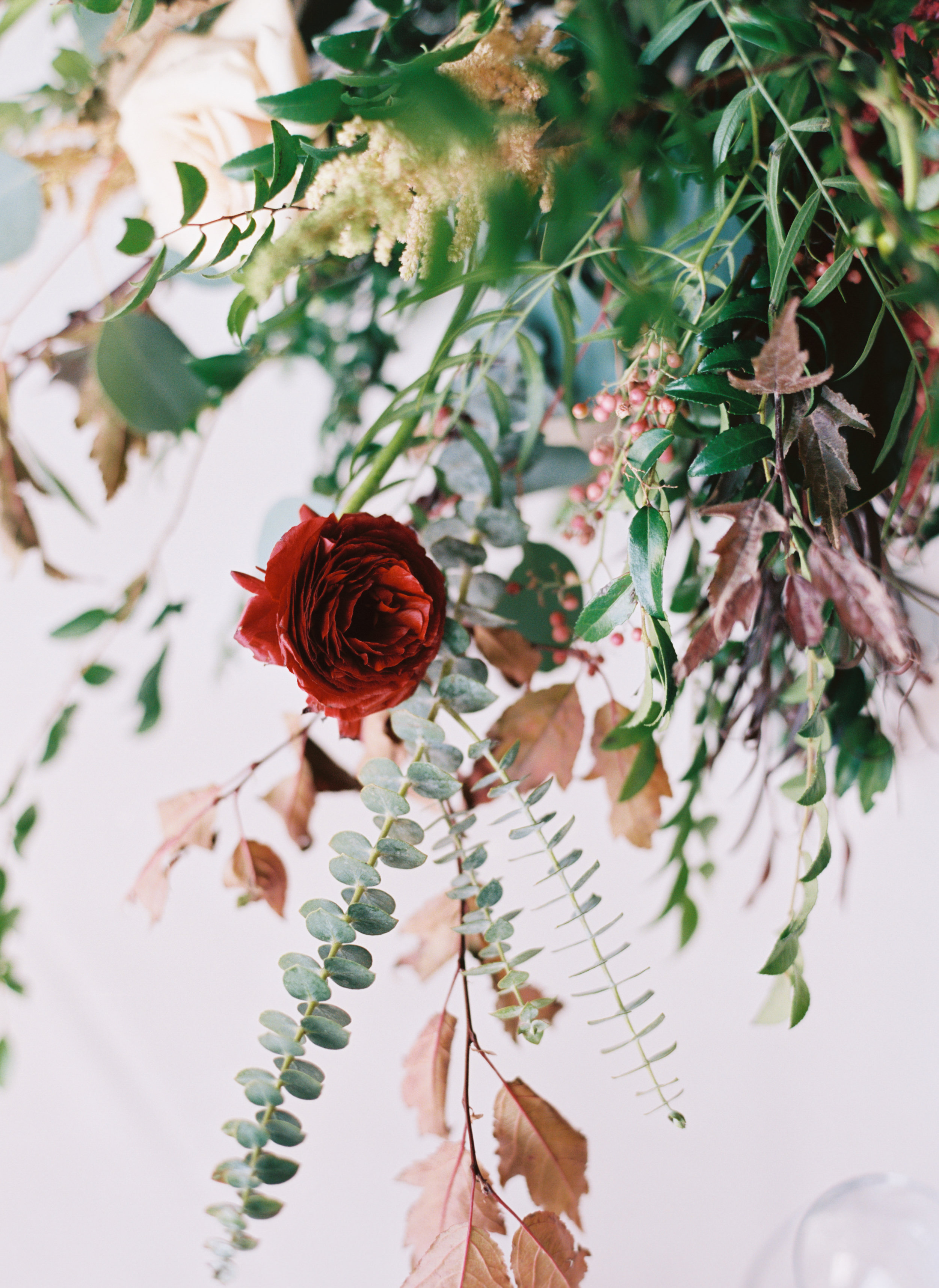 Centerpieces with marsala dahlias, burgundy ranunculus, peach astilbe, protea, and natural greenery // Nashville Wedding Florist // Country Music Hall of Fame