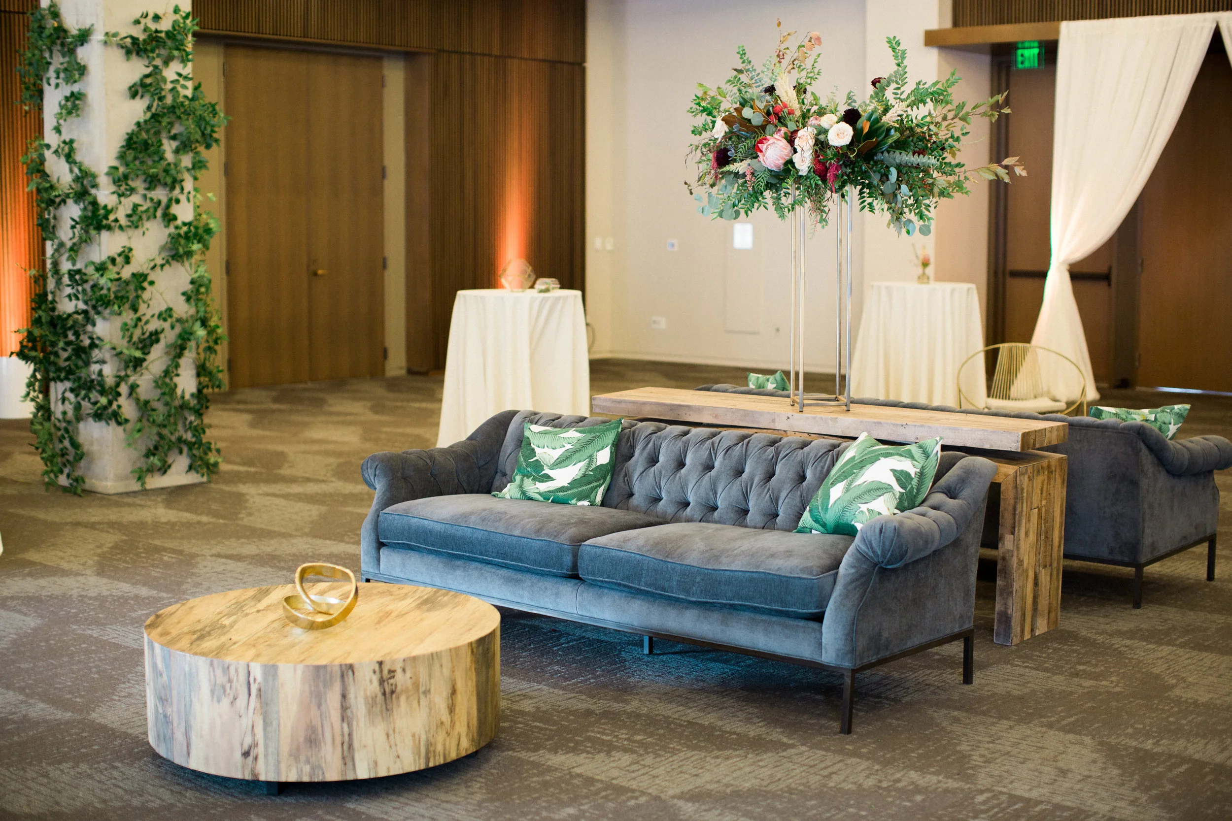 Lush, untamed elevated centerpiece with king protea, marsala dahlias, soft peach astilbe, and natural greenery // Nashville Wedding Floral Design