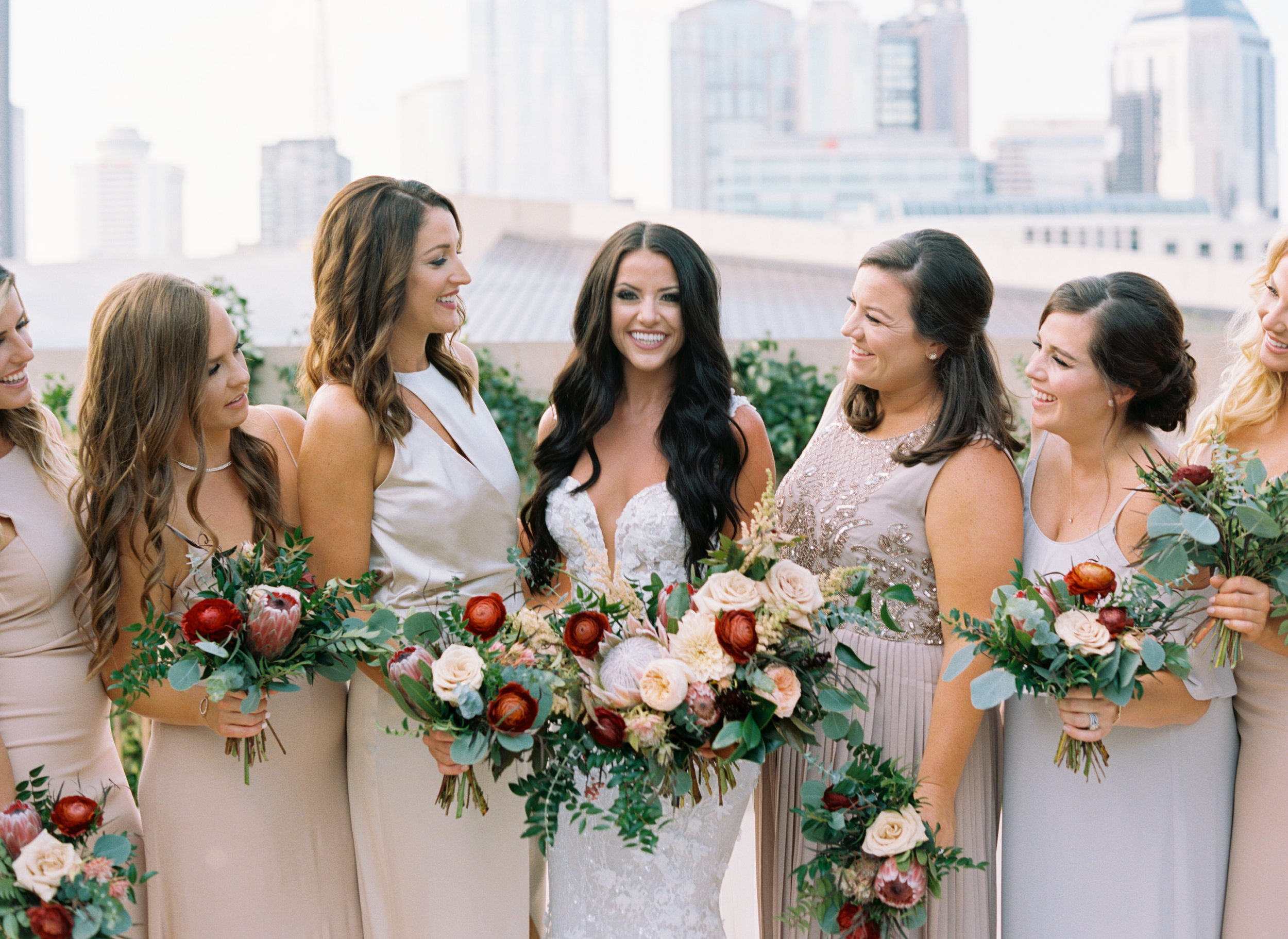 Muted pastel bridesmaid style with pops of marsala and burgundy florals // Nashville Wedding Floral Design