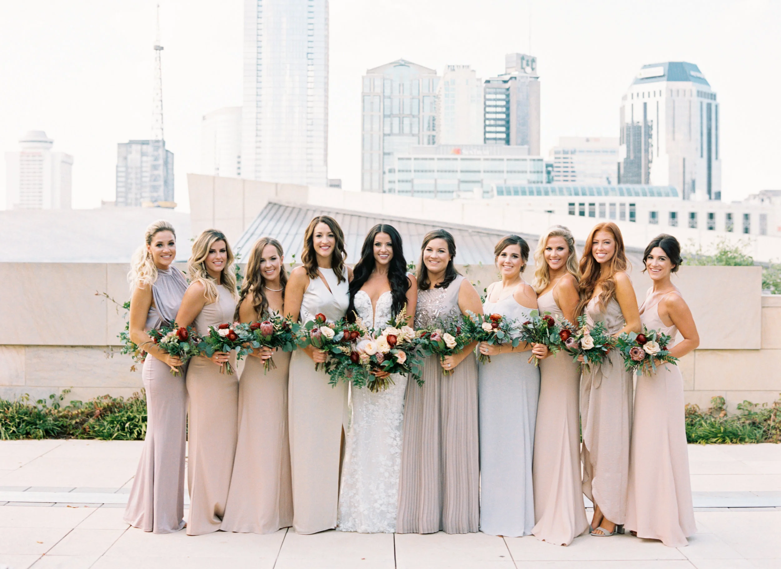 Muted pastel bridesmaid style with pops of marsala and burgundy florals // Nashville Wedding Floral Design