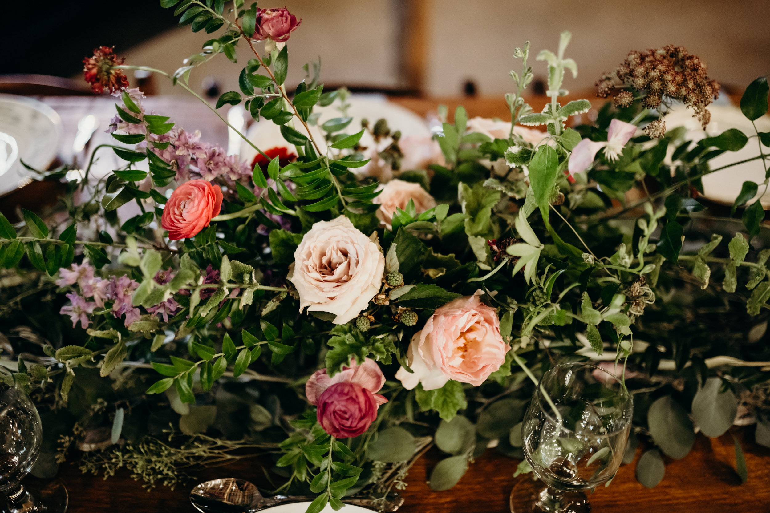 Natural floral arrangement with garden roses, ranunculus, and chocolate laceflower // Meadow Hill Farm Wedding