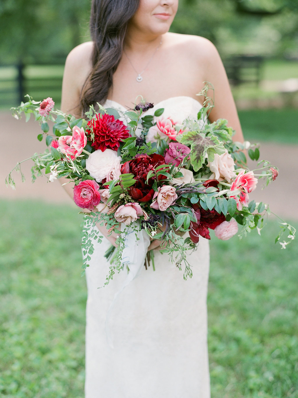 Lush bridal bouquet with marsala dahlias, pink tulips, burgundy peonies, pink ranunculus, and maidenhair fern // Nashville Wedding Floral Design