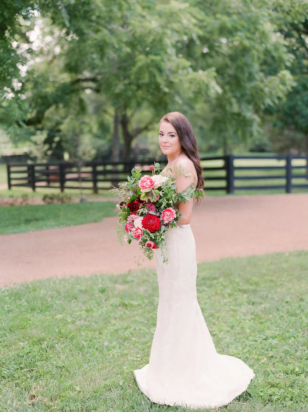 Lush bridal bouquet with marsala dahlias, pink tulips, burgundy peonies, pink ranunculus, and maidenhair fern // Belle Meade Wedding Floral Design