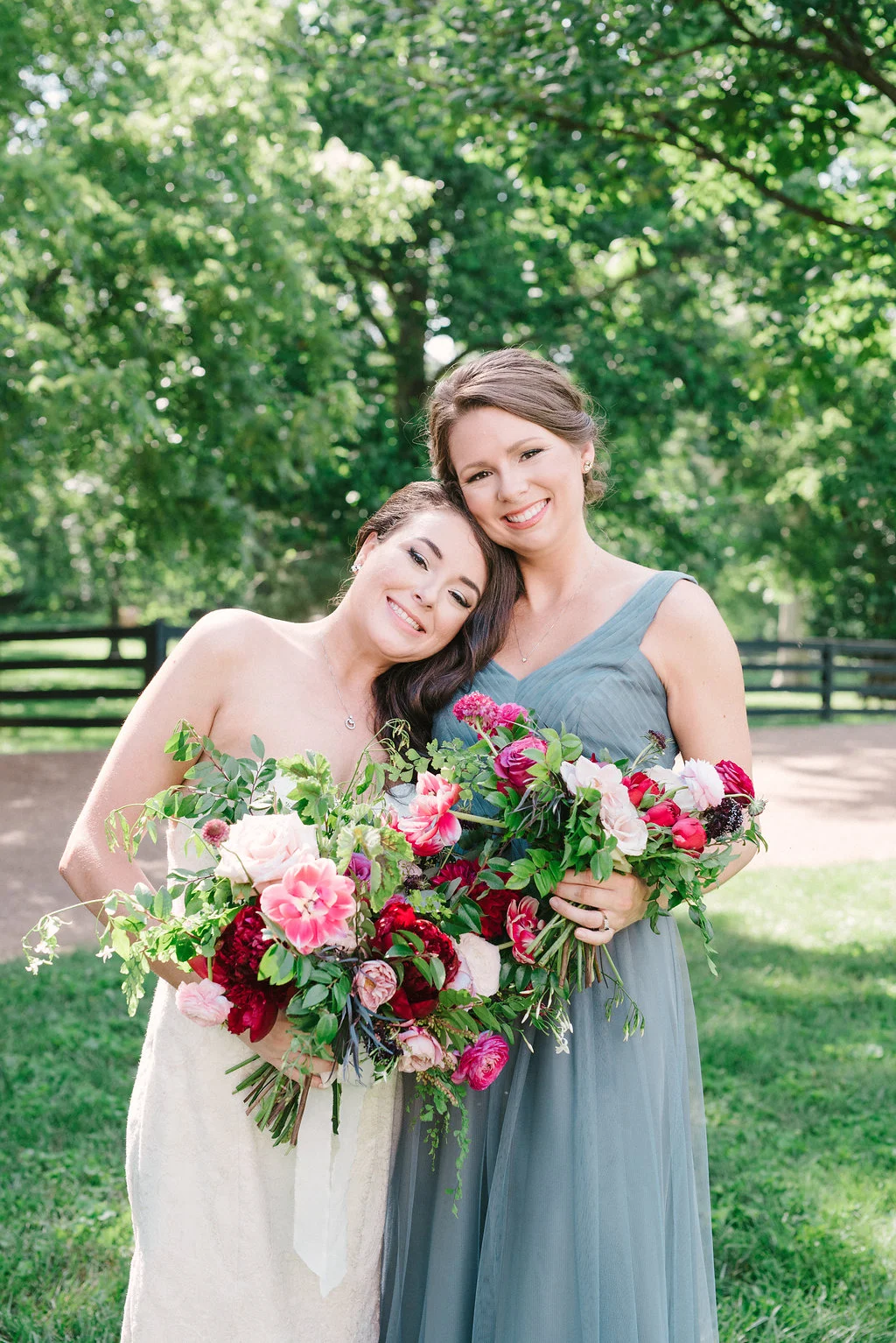 Lush bridal bouquet with marsala dahlias, pink tulips, burgundy peonies, pink ranunculus, and maidenhair fern // Belle Meade Wedding Floral Design
