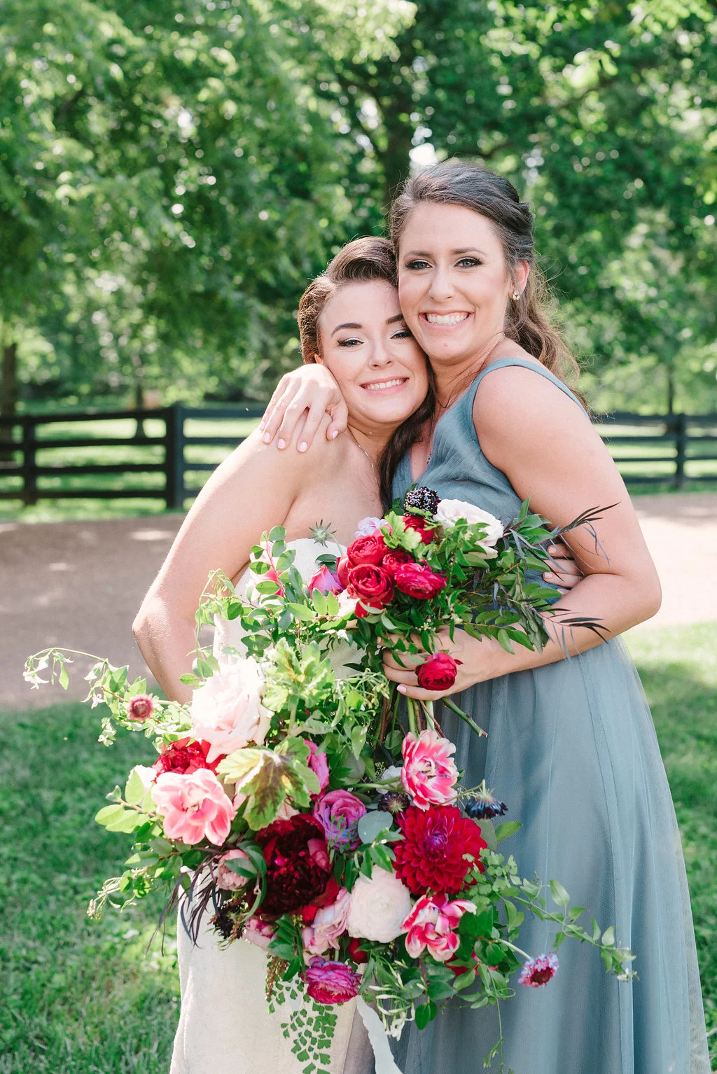 Lush bridal bouquet with marsala dahlias, pink tulips, burgundy peonies, pink ranunculus, and maidenhair fern // Belle Meade Wedding Floral Design
