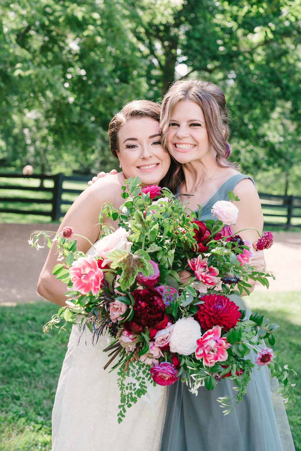 Lush bridal bouquet with marsala dahlias, pink tulips, burgundy peonies, pink ranunculus, and maidenhair fern // Belle Meade Wedding Floral Design