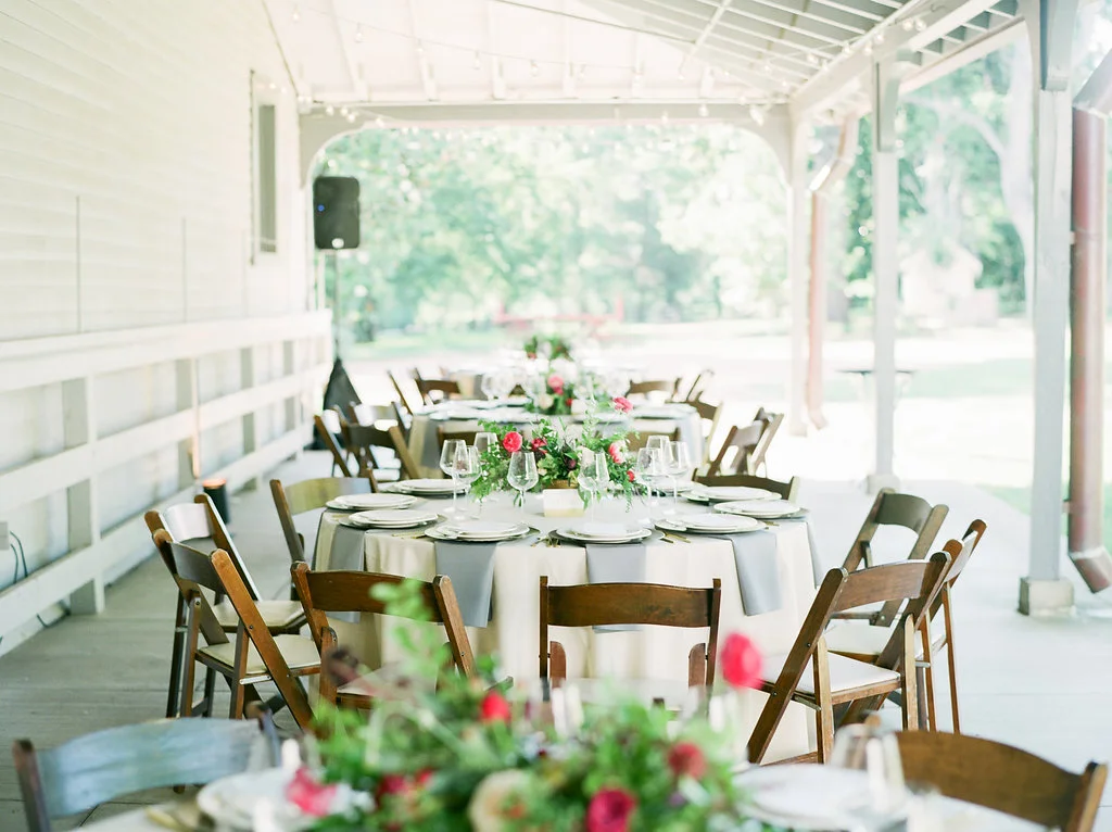 Raspberry and marsala floral centerpiece with ranunculus, tulips, and garden roses // Nashville Wedding Florist