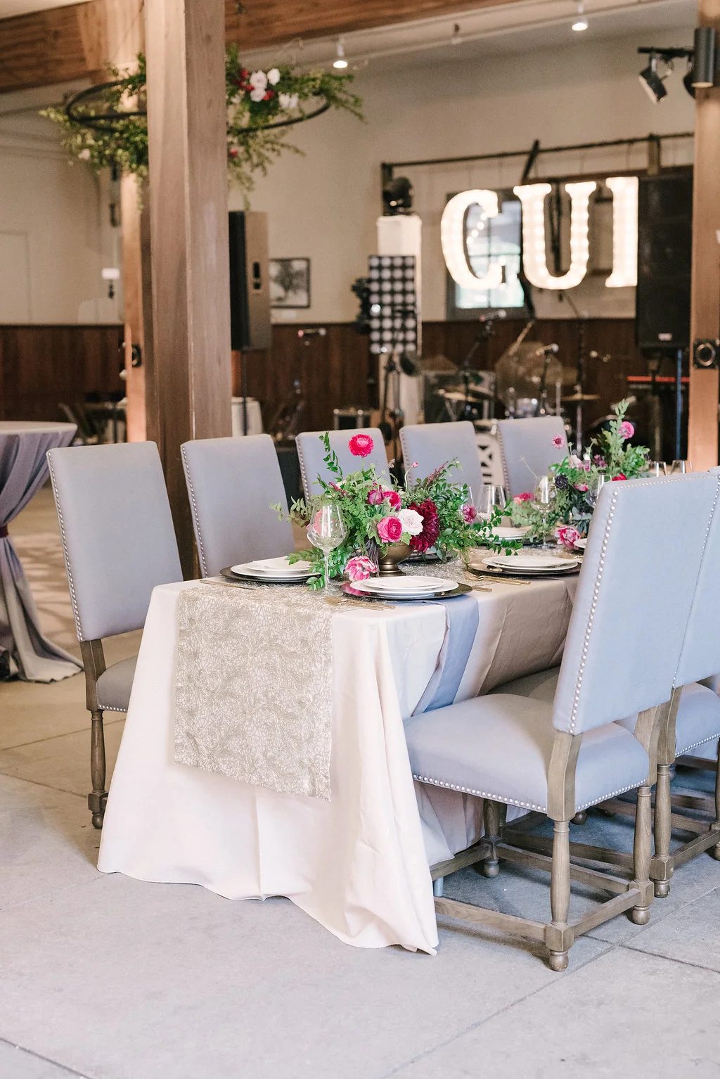 Raspberry and marsala floral centerpiece with ranunculus, tulips, and garden roses // Nashville Wedding Florist // Belle Meade Plantation Carriage House Reception