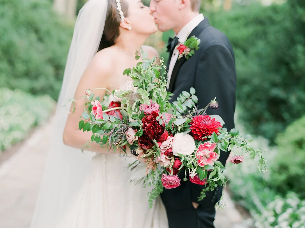 Lush bridal bouquet with marsala and raspberry flowers and natural greenery // Nashville Wedding Flowers
