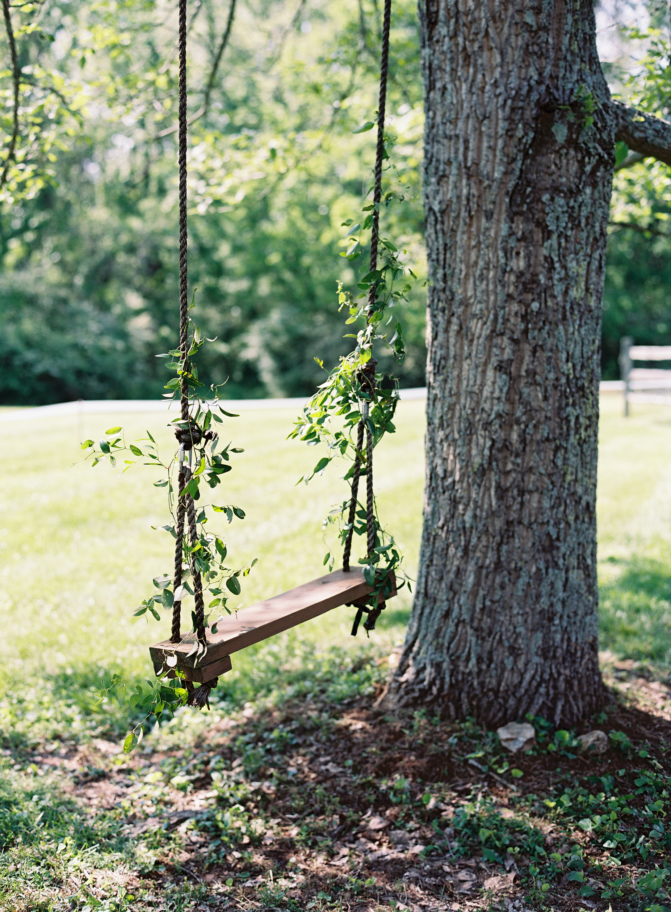 Delicate vines on a wooden swing // Nashville Wedding Floral Design
