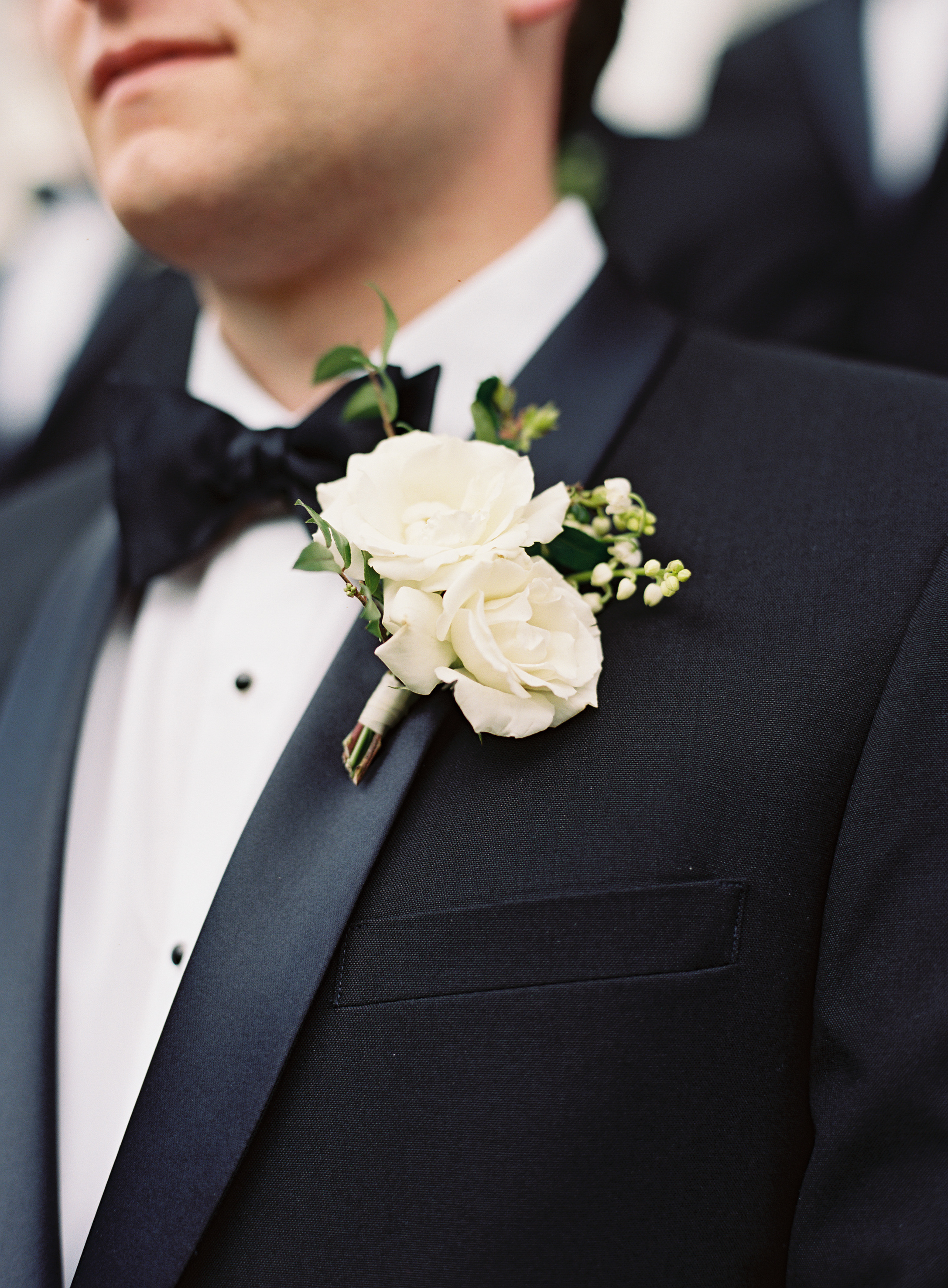 Classic groom style--black tux and white floral boutonniere // Franklin Wedding Florist
