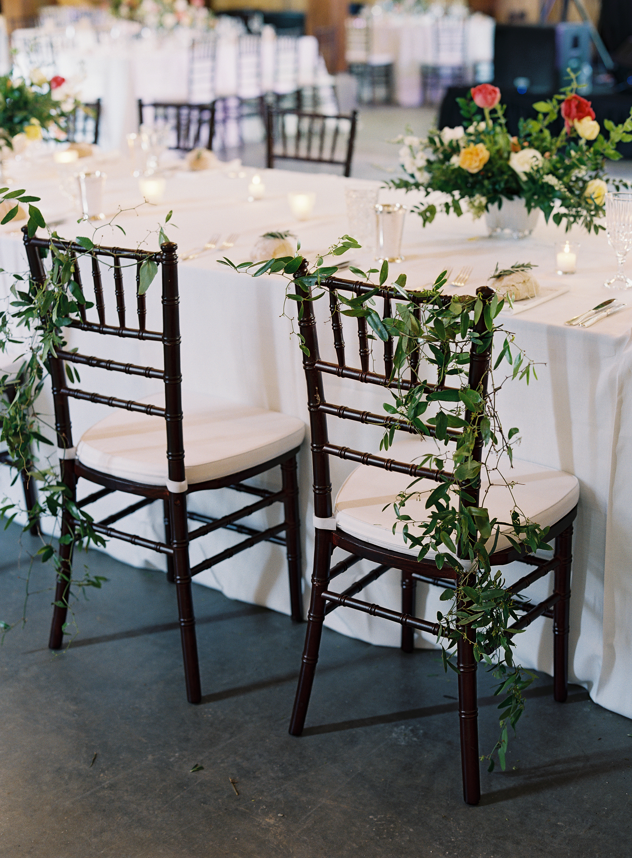 Airy greenery for the bride and groom's chairs // Nashville Wedding Floral Design
