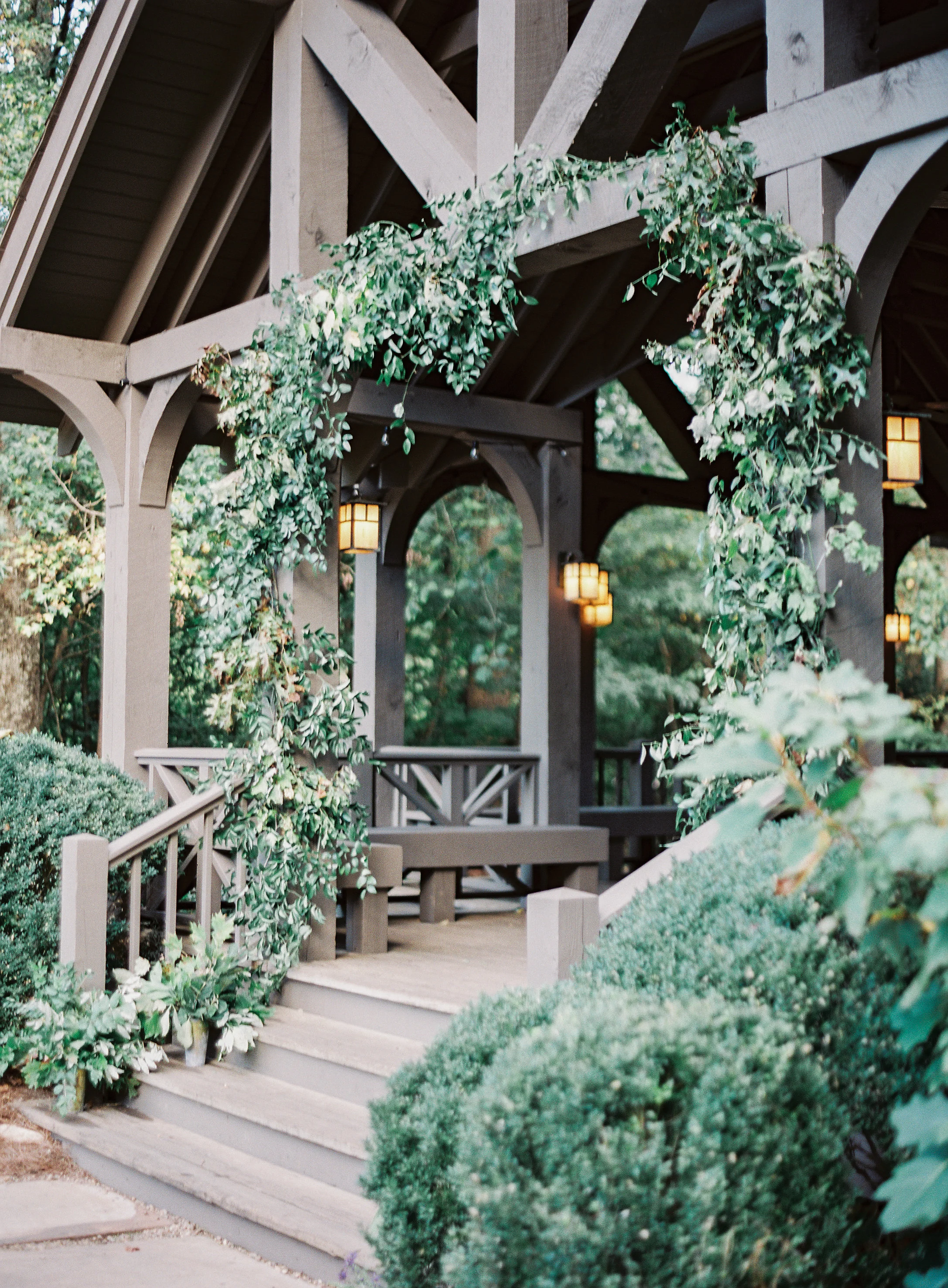 Lush greenery installation at the Yallerhammer Pavilion // Blackberry Farm Wedding Florist