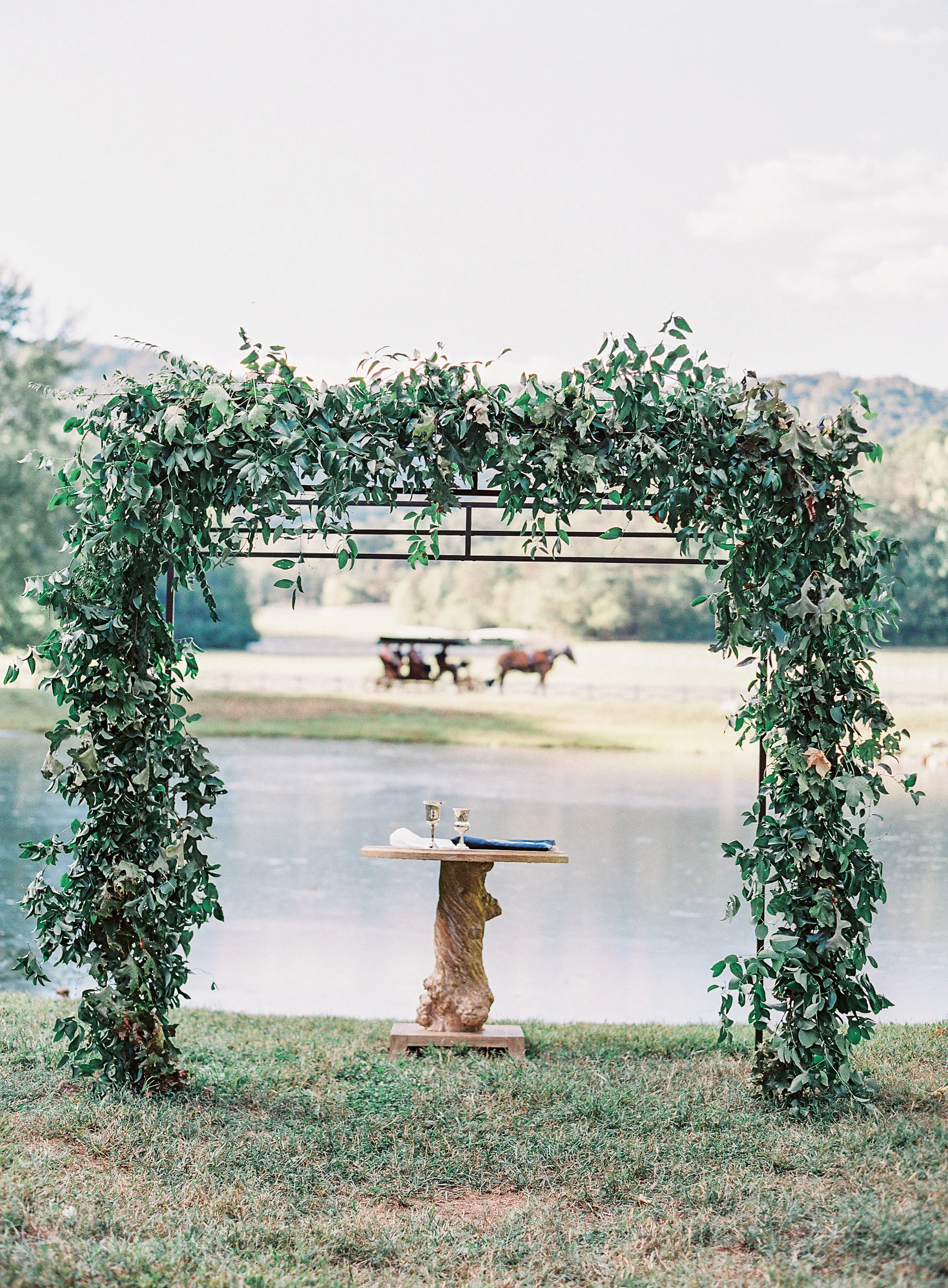 All greenery arch for the wedding ceremony // Blackberry Farm Wedding Floral Design