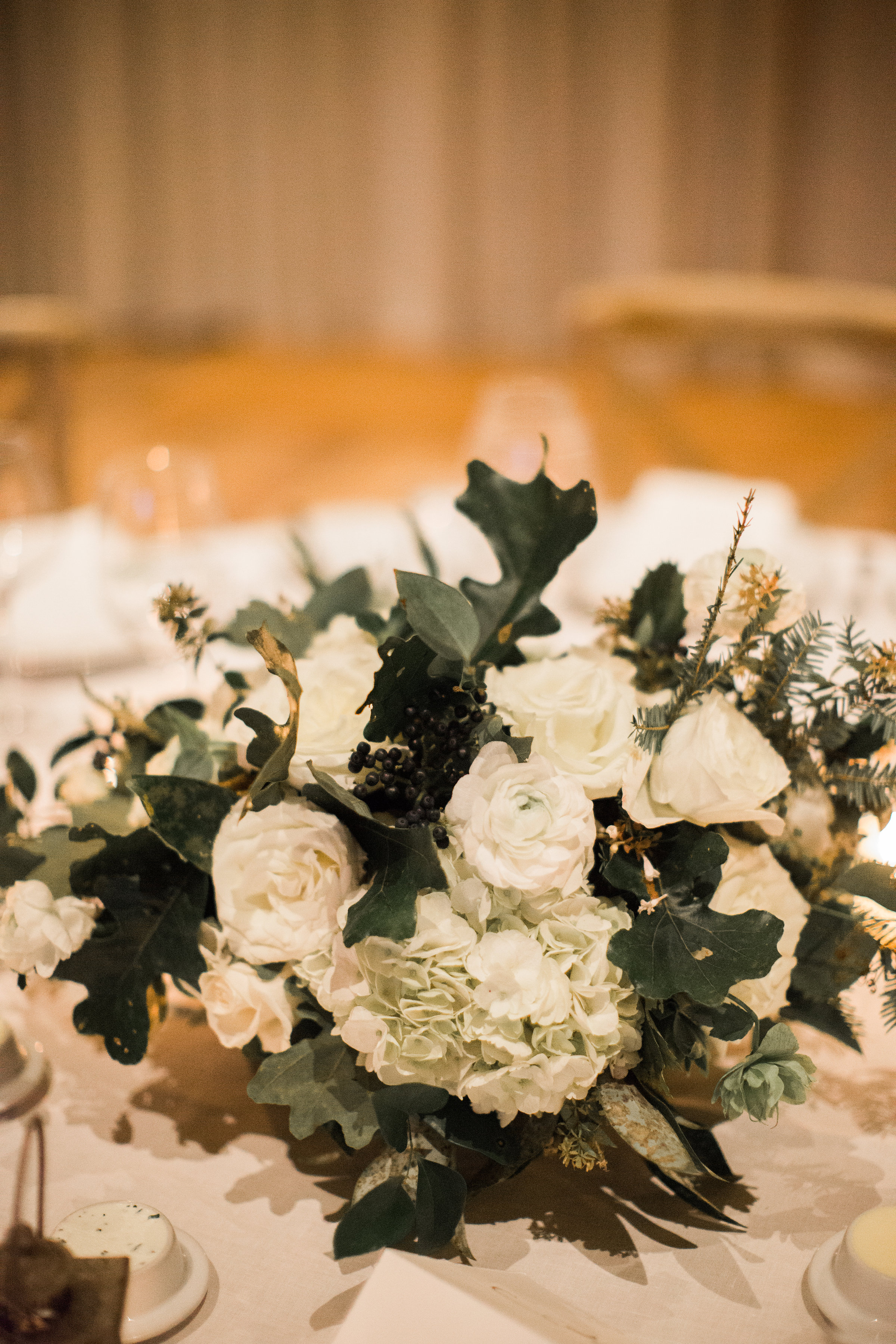 Natural, untamed centerpiece with white flowers and greenery // Blackberry Farm Wedding Florist