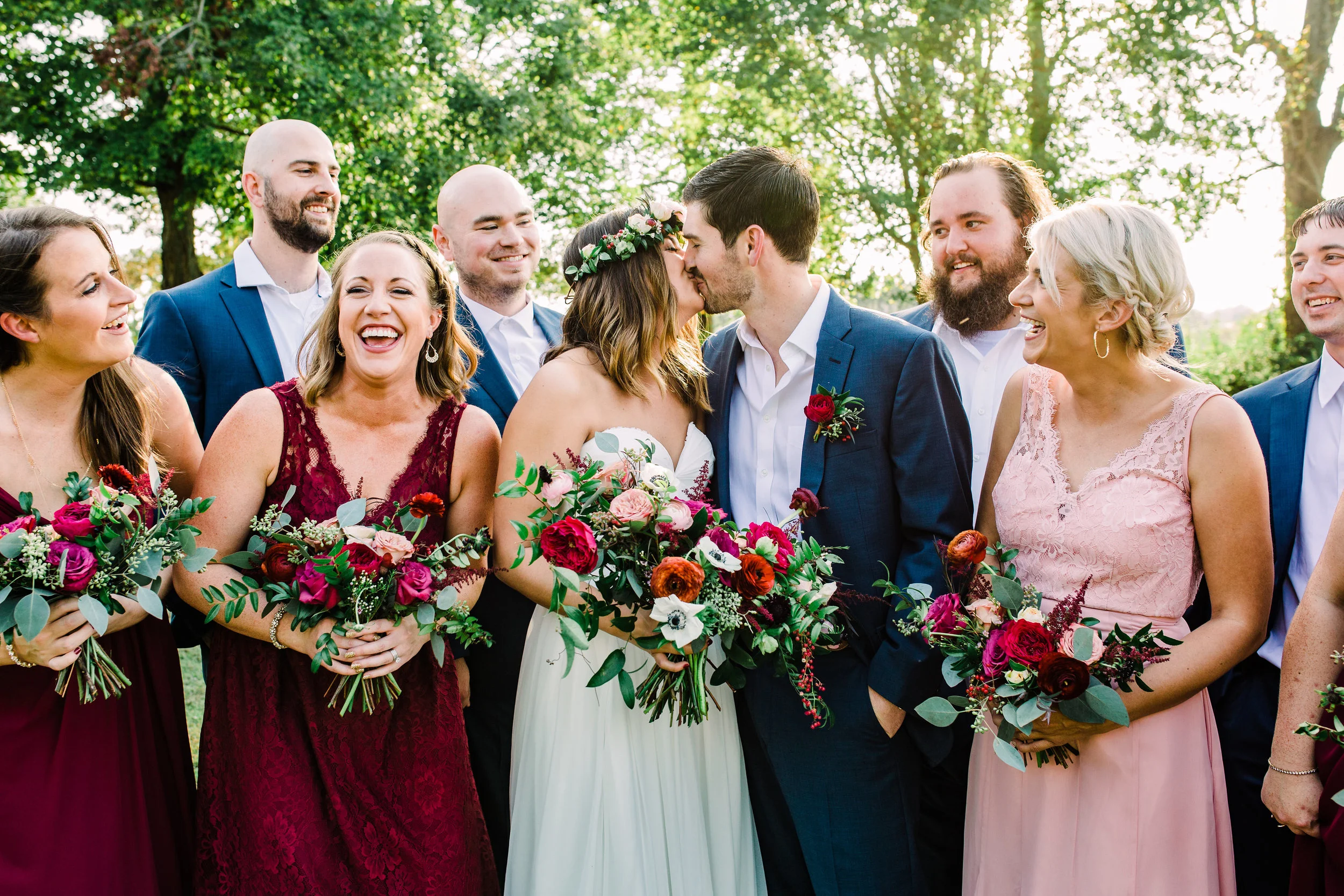 Natural bridal bouquet with marsala ranunculus, anemones, and trailing greenery // Nashville Wedding Floral Design