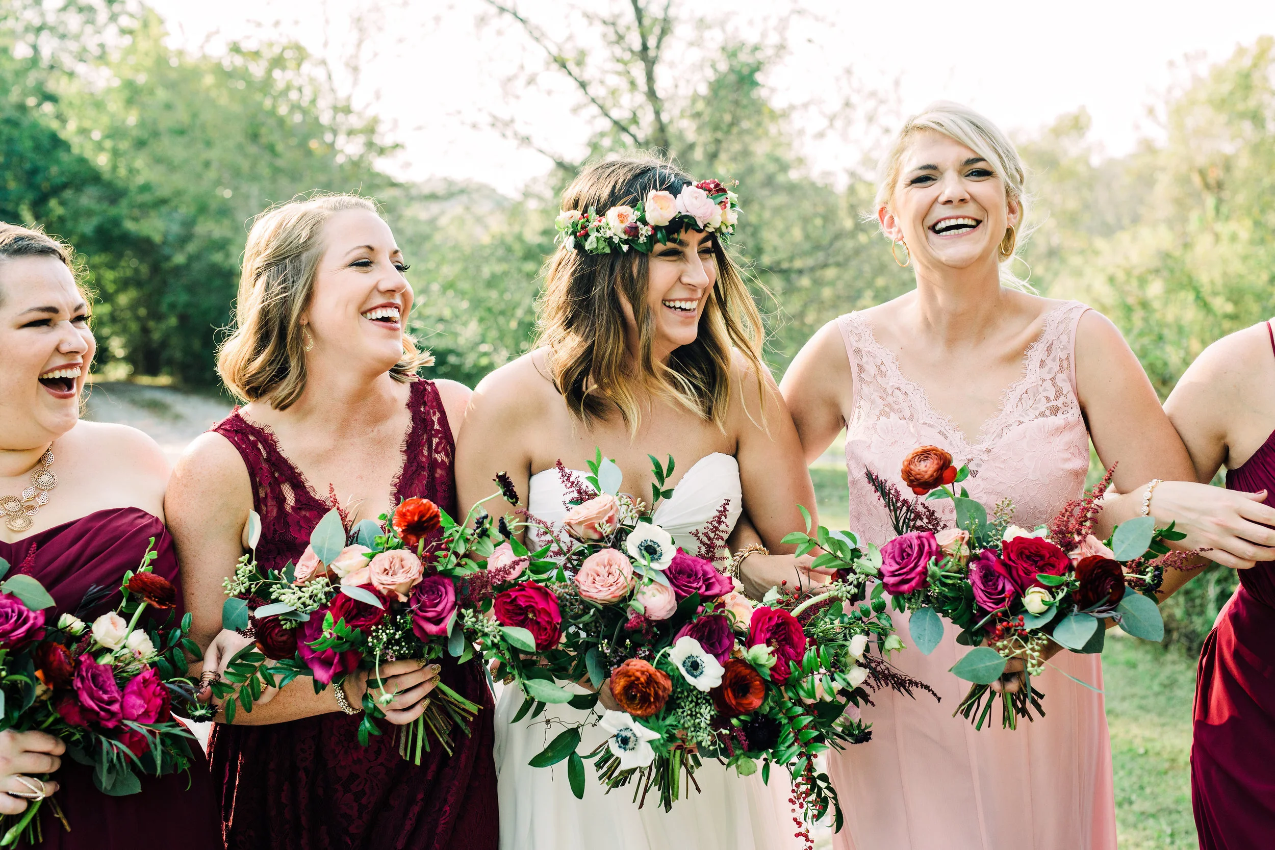Natural bridal bouquet with marsala ranunculus, anemones, and trailing greenery // Nashville Wedding Floral Design